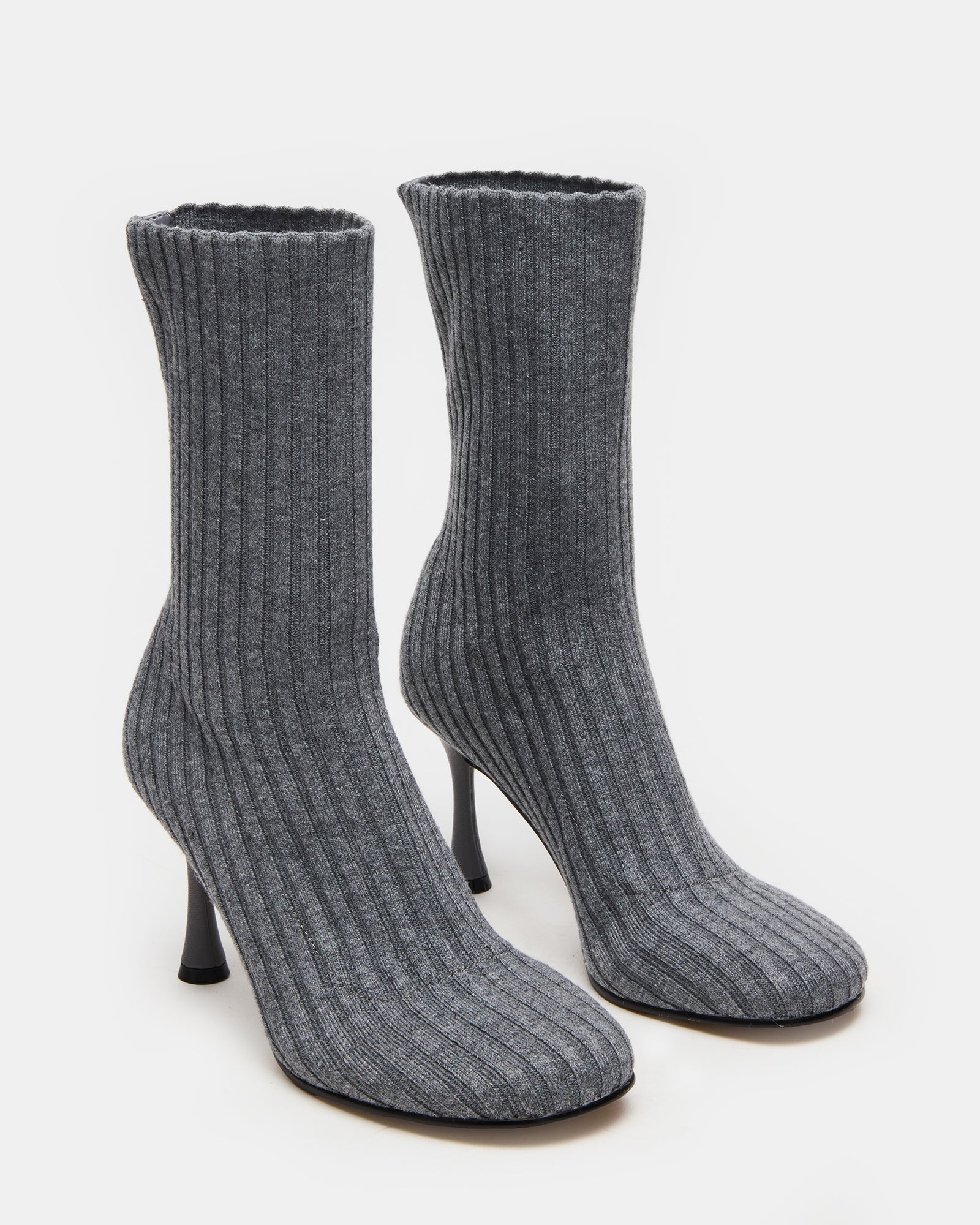 Top-down angle of ankle boots placed on wooden floor, great for daily wear