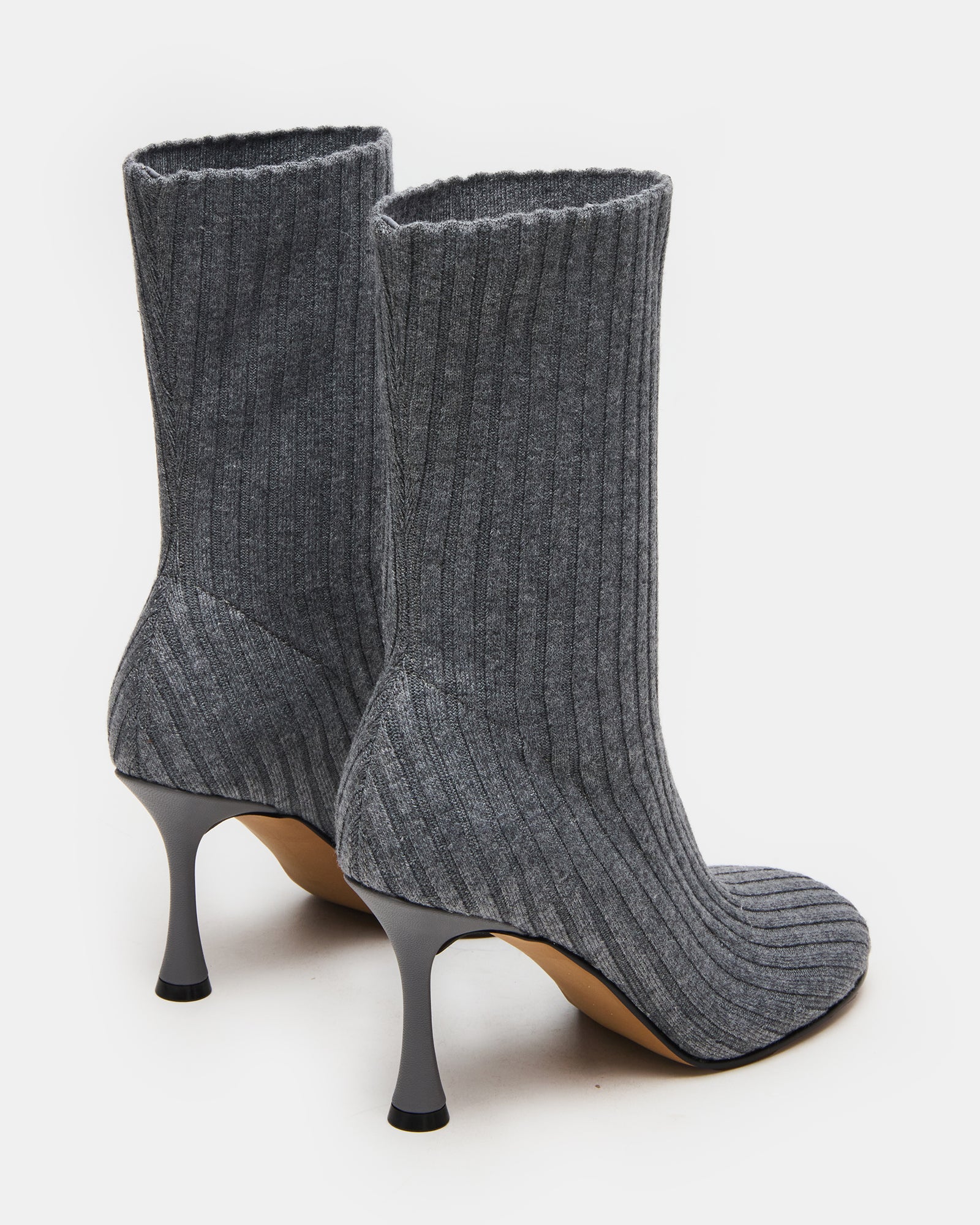 Top-down angle of ankle boots placed on wooden floor, great for daily wear