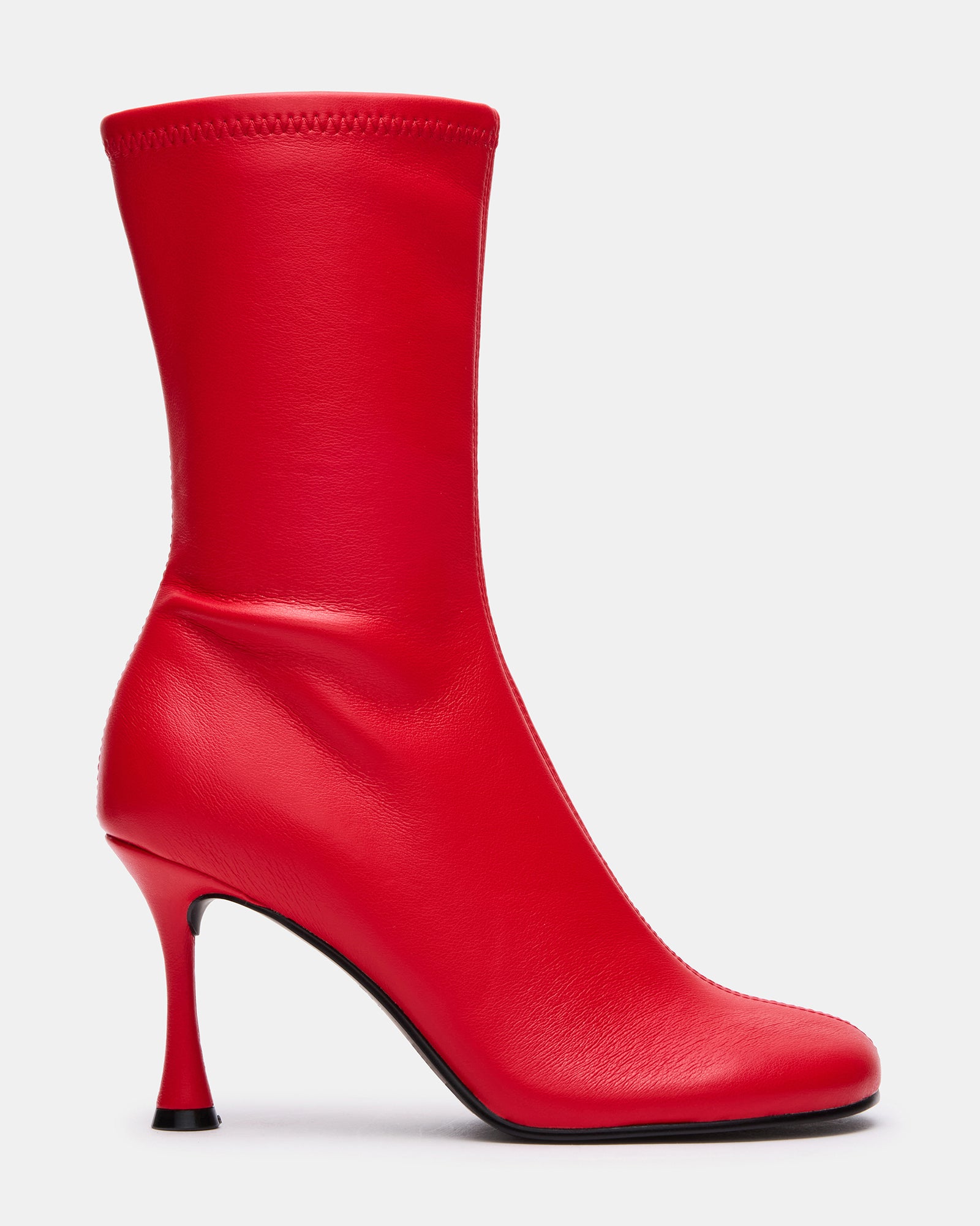 Side view of black booties with heel, showcasing sleek design.