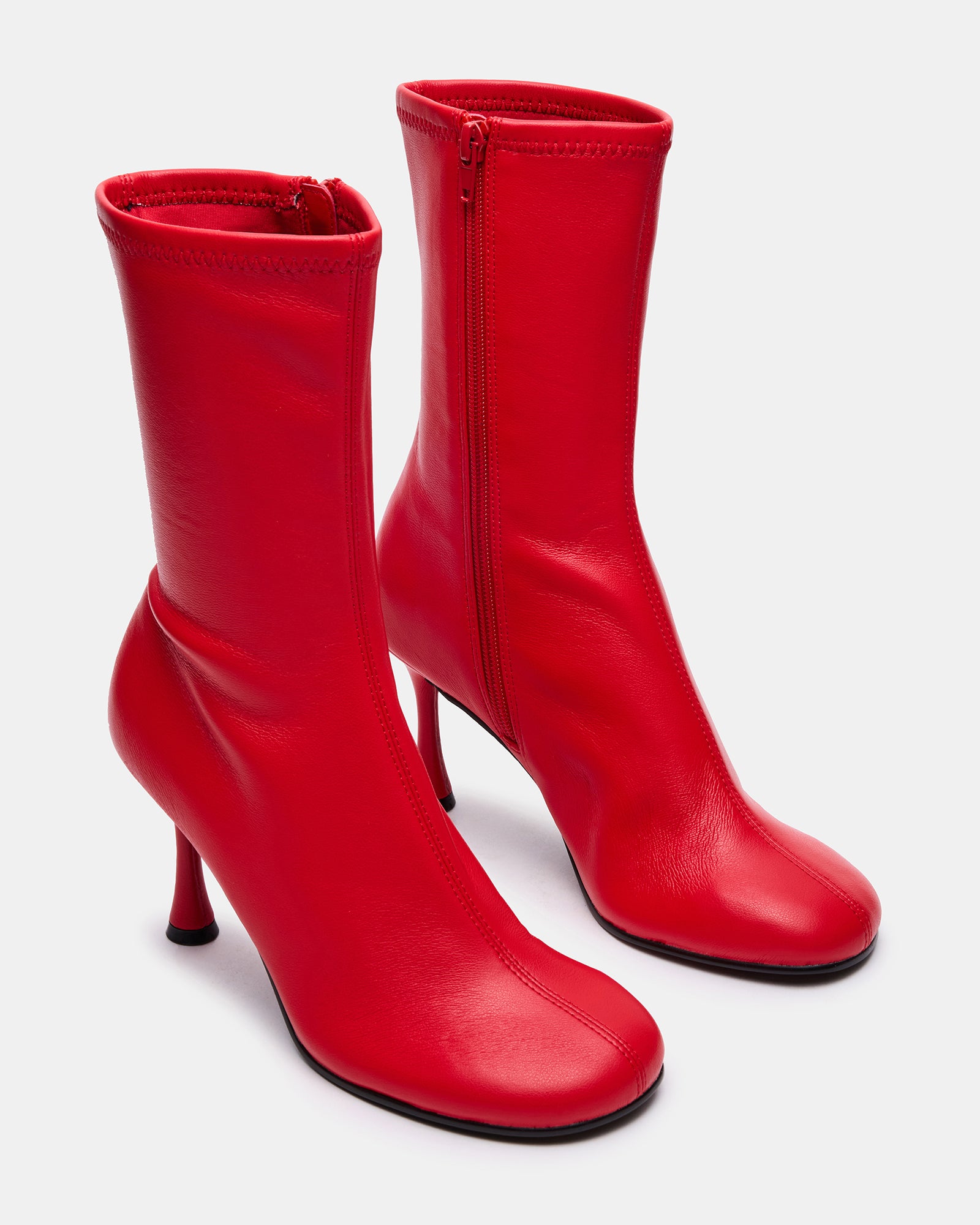 Lorenza black ankle boots styled with a chic outfit for a night out.