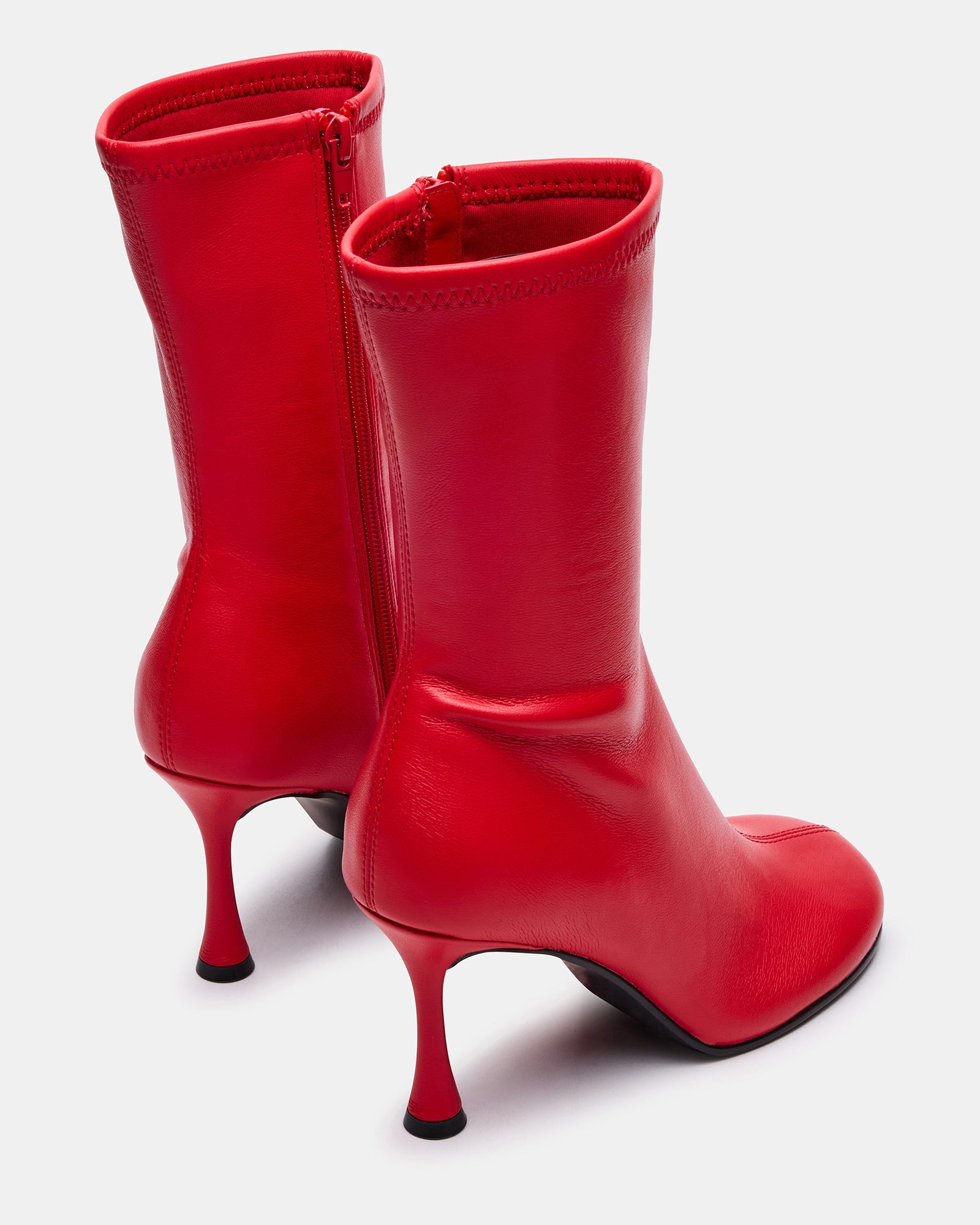 Lorenza black ankle boots styled with a chic outfit for a night out.
