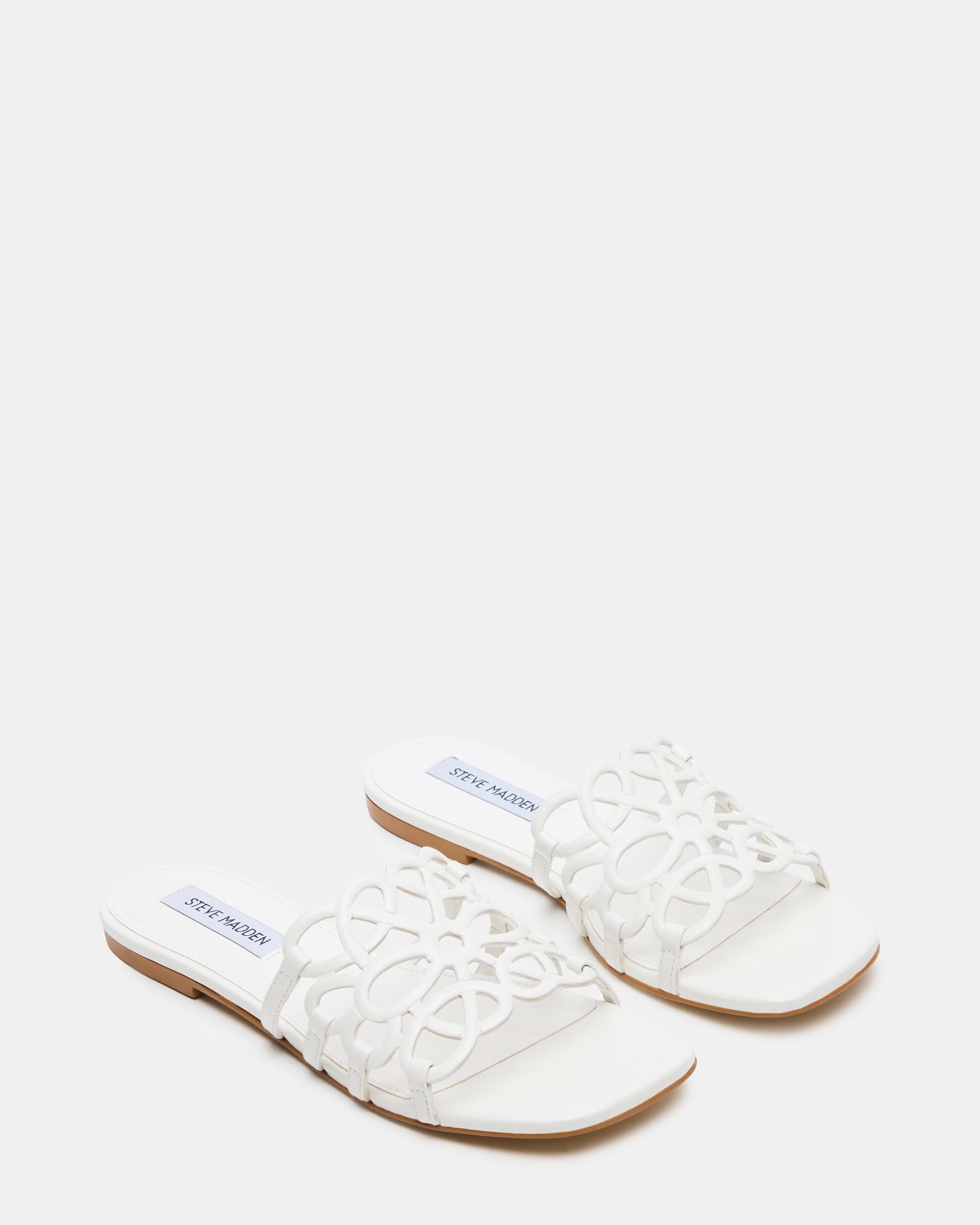 Woman wearing sandals slides shoes womens with cropped jeans near beach