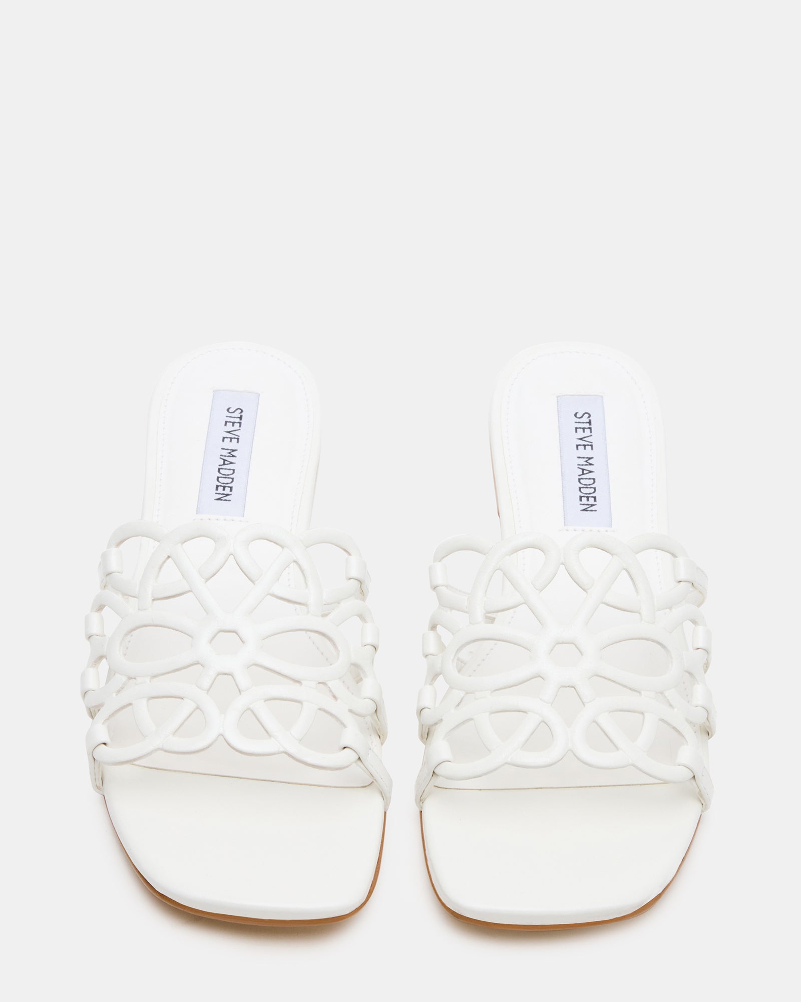 Top view of white slide sandals with square toe and leather finish