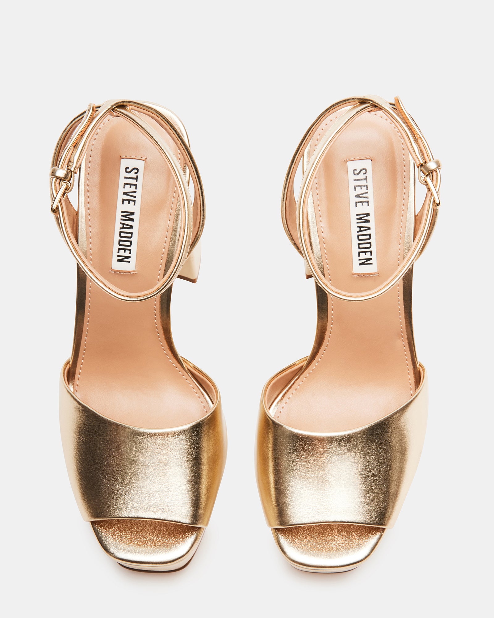Close-up of the crossed ankle strap on Lourdes block heel sandals.