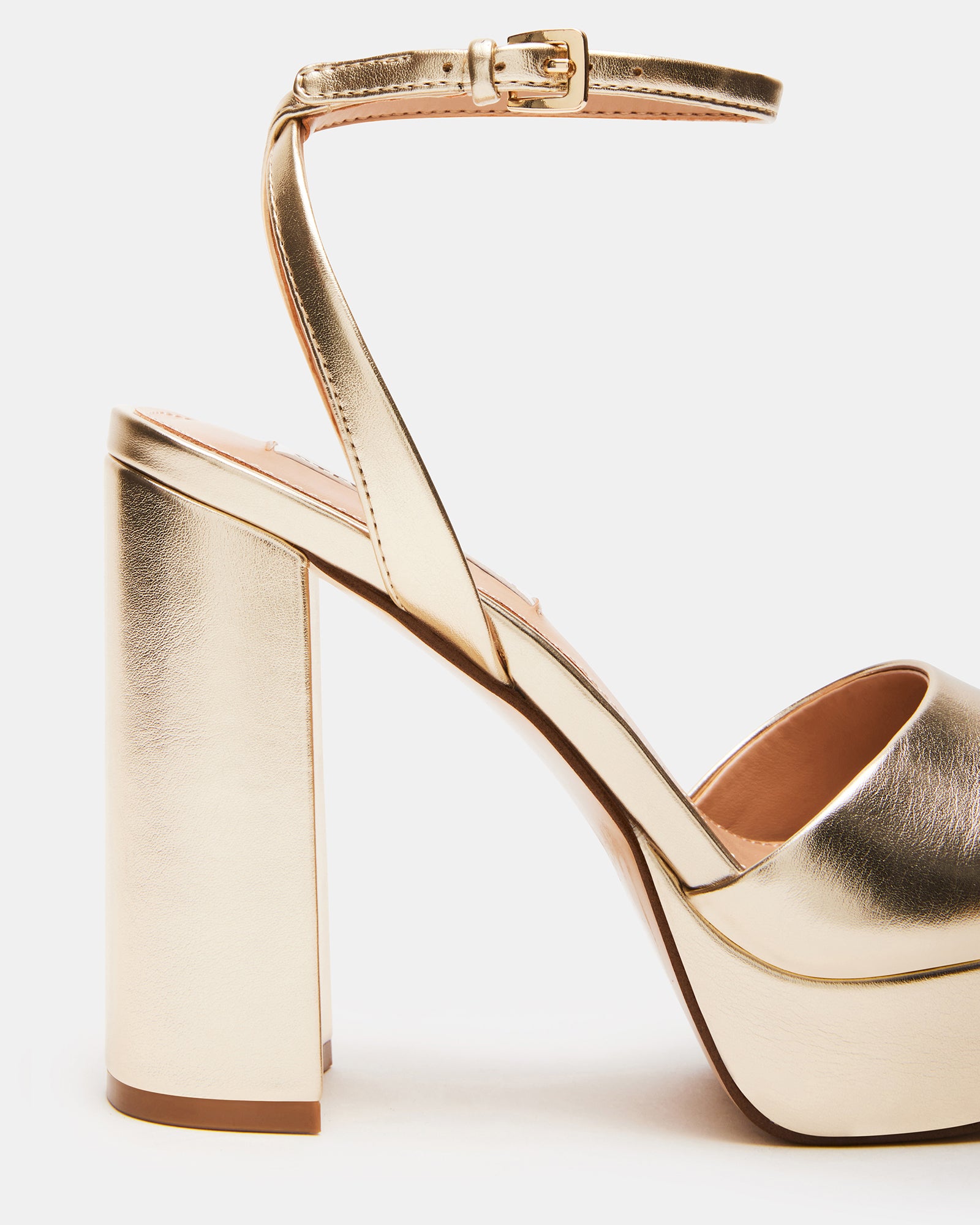 Lourdes vegan block heel dress sandals in a stylish setting.