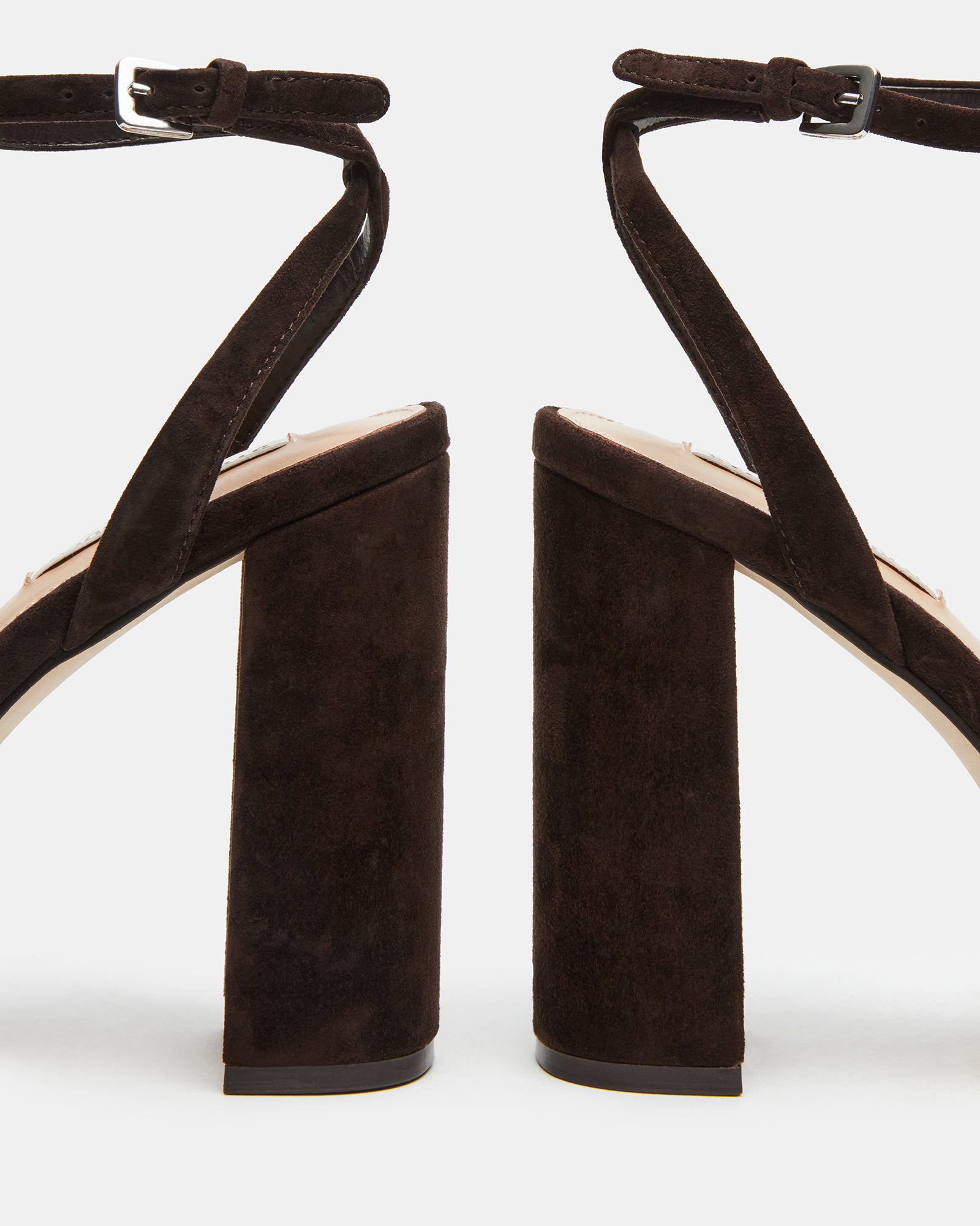 Side view of chocolate brown suede block heel sandals.