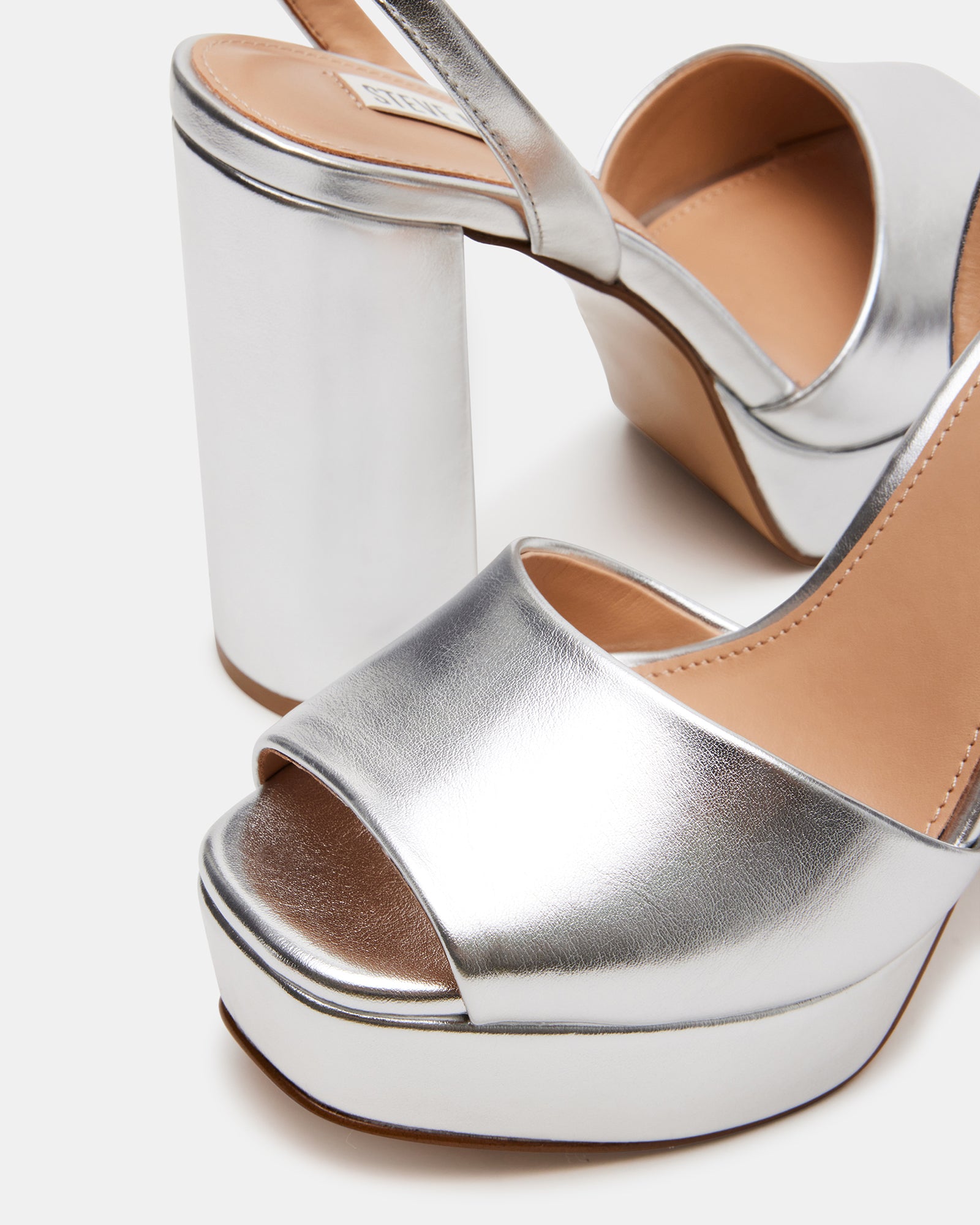 Lourides silver sandals modeled with a summer dress