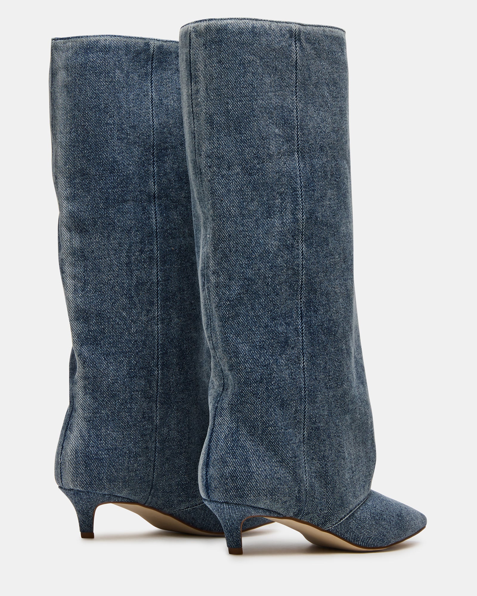 Close-up of the brown leather boots, highlighting quality craftsmanship.