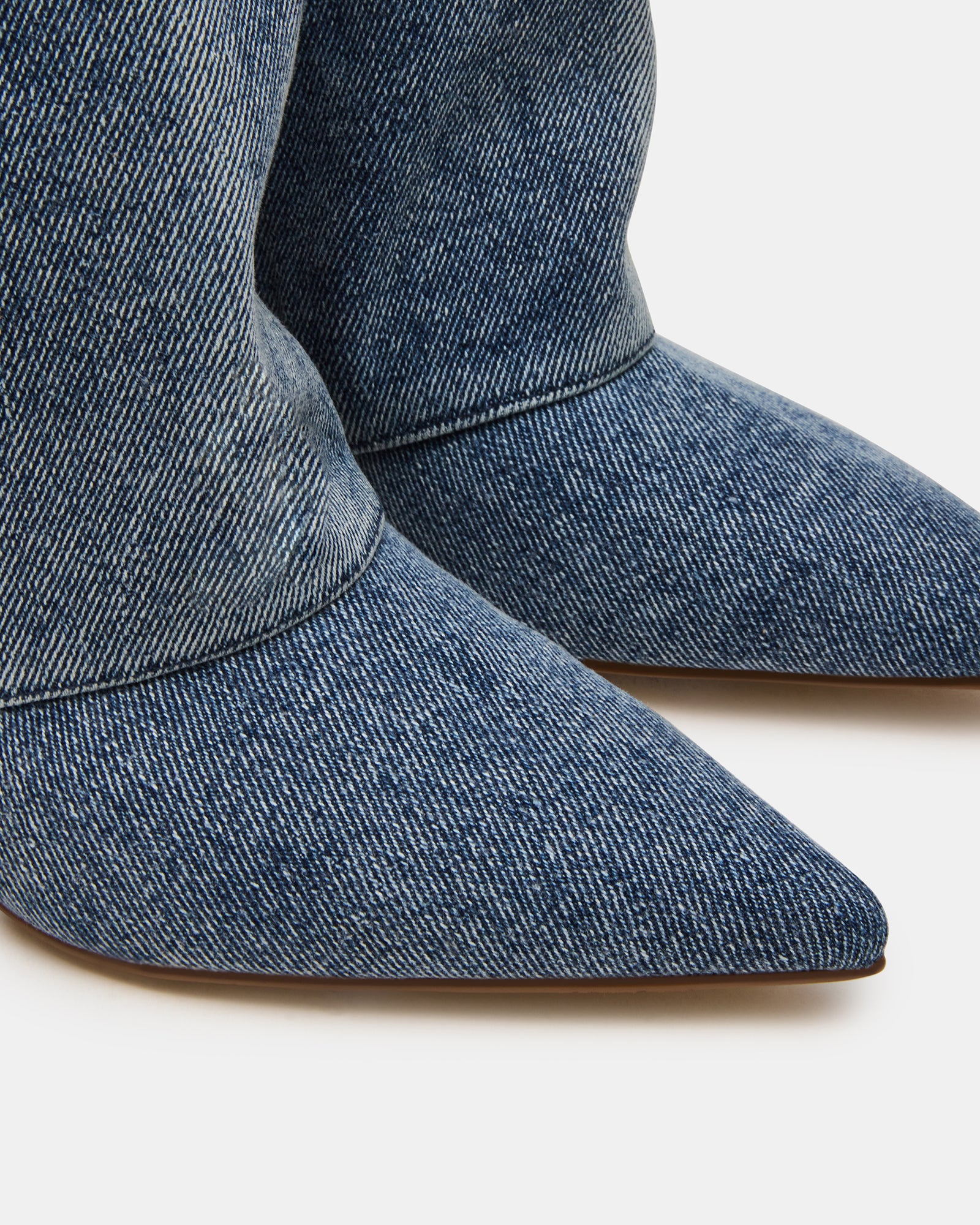Luca boots worn with a chic outfit for a stylish look.