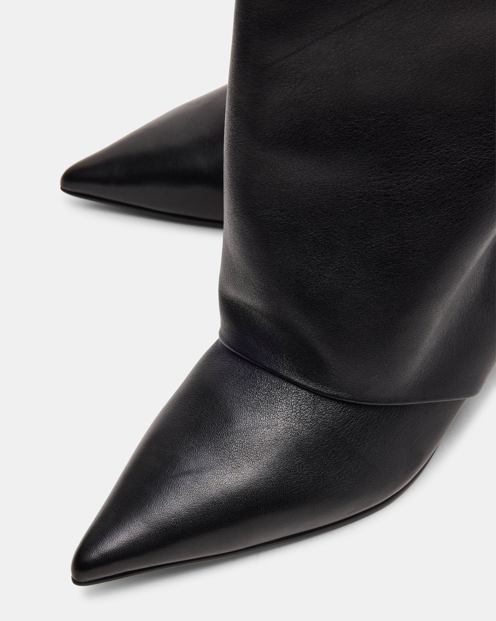Close-up of the heel and upper material of LUCA black leather ankle boots