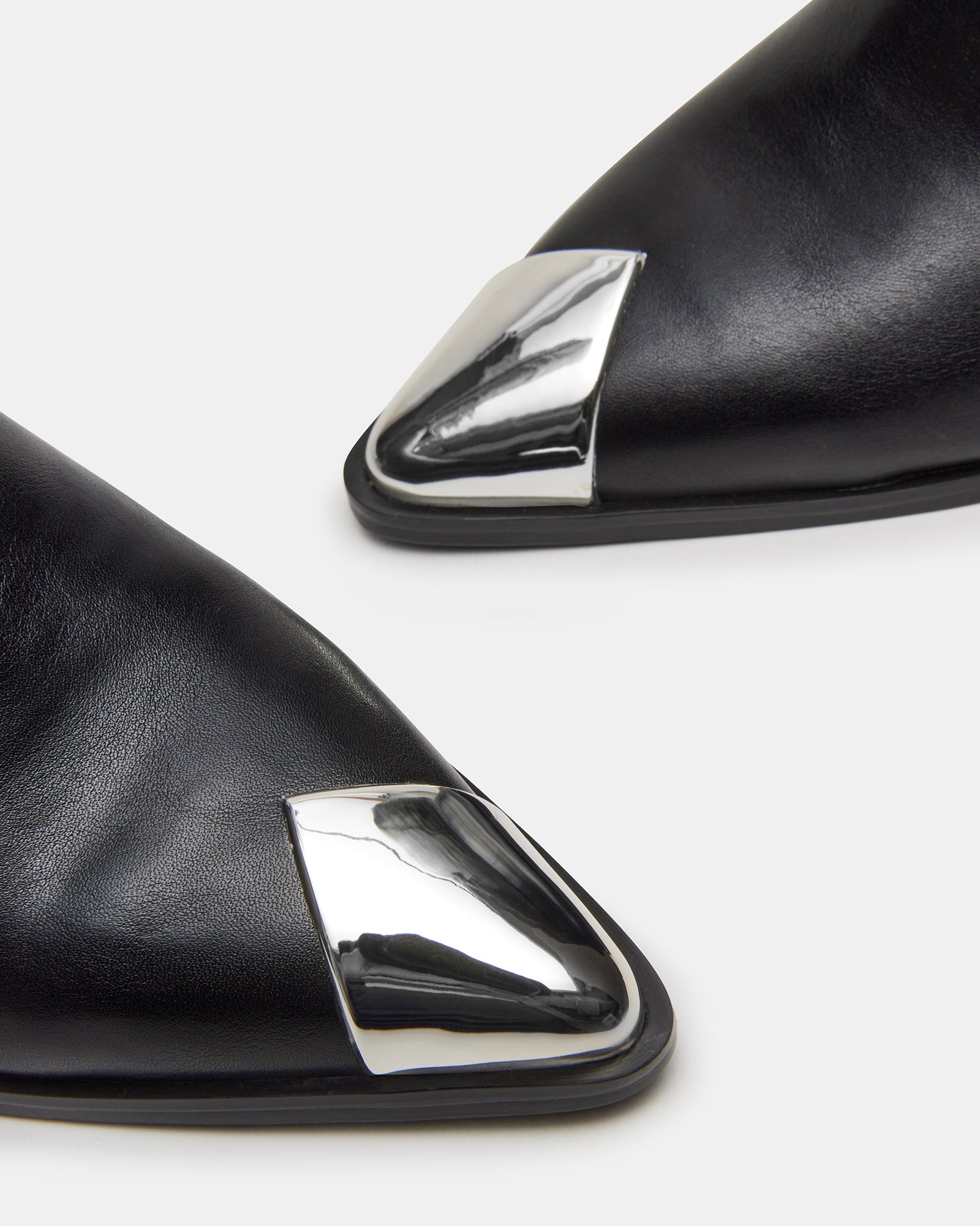 Side view of Luciana black pointed toe boots with sleek design