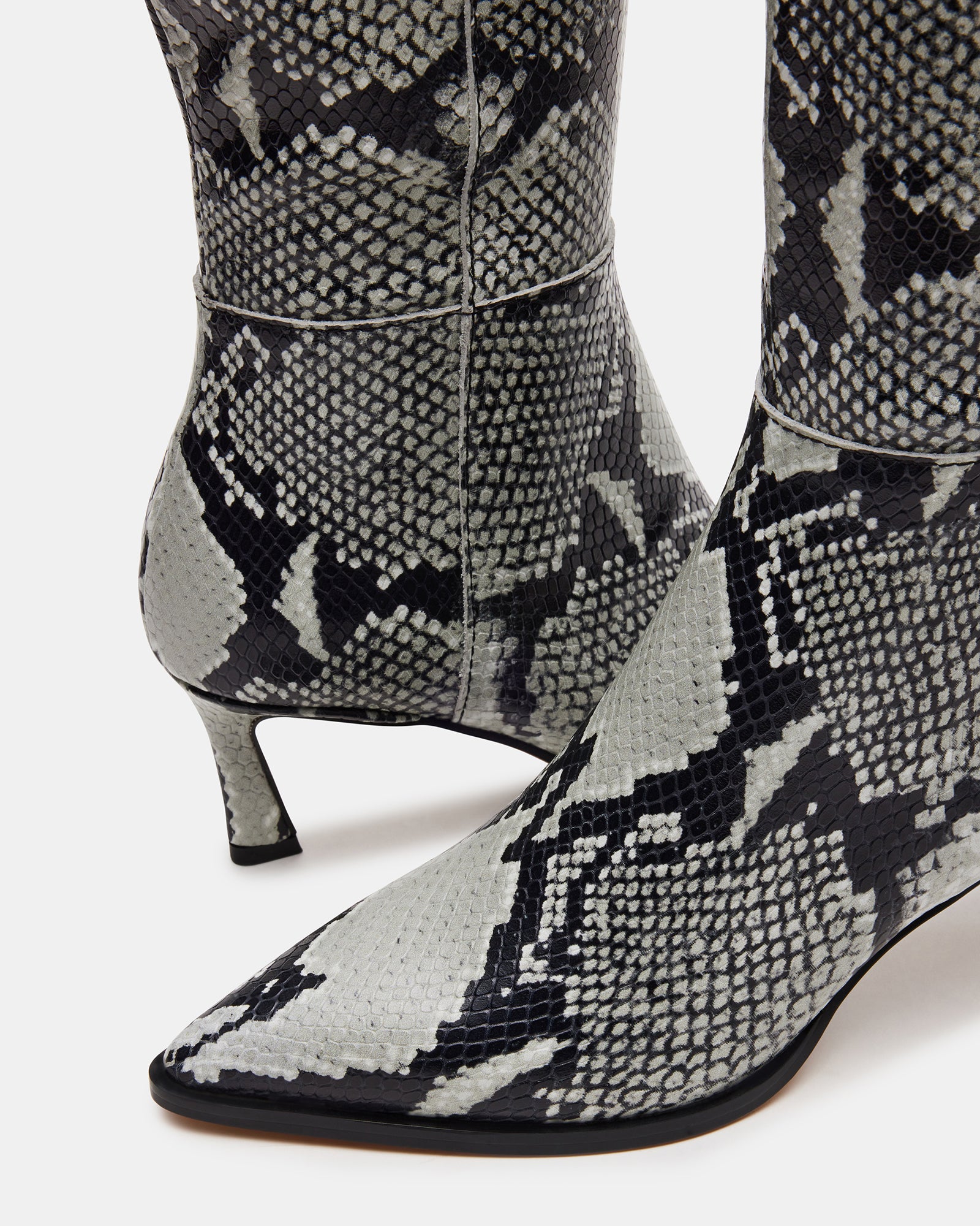 Lucid knee-high boots styled with a fashionable outfit, ideal for any occasion.