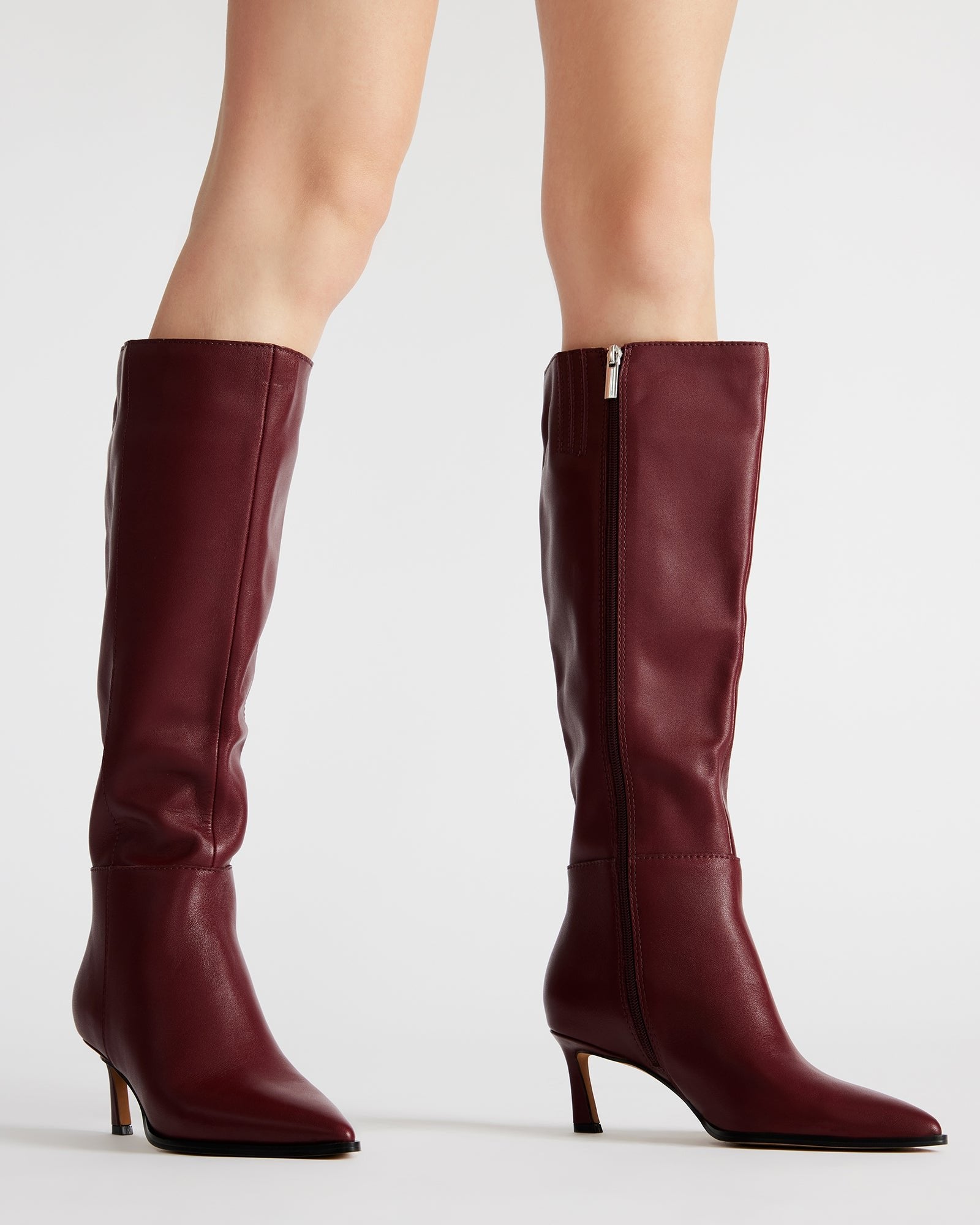 Model wearing Lucid burgundy boots with a stylish autumn outfit