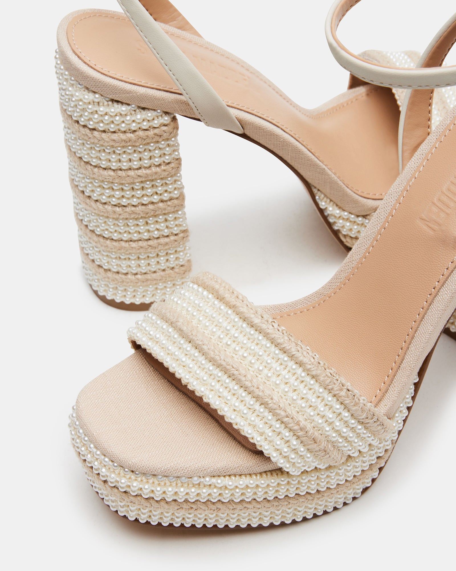 Side view of raffia block heel sandals with ankle strap design