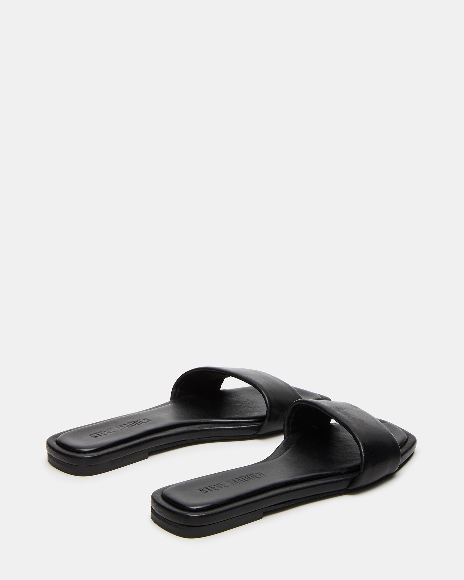 Pair of sandals styled with a summer dress for outfit inspiration