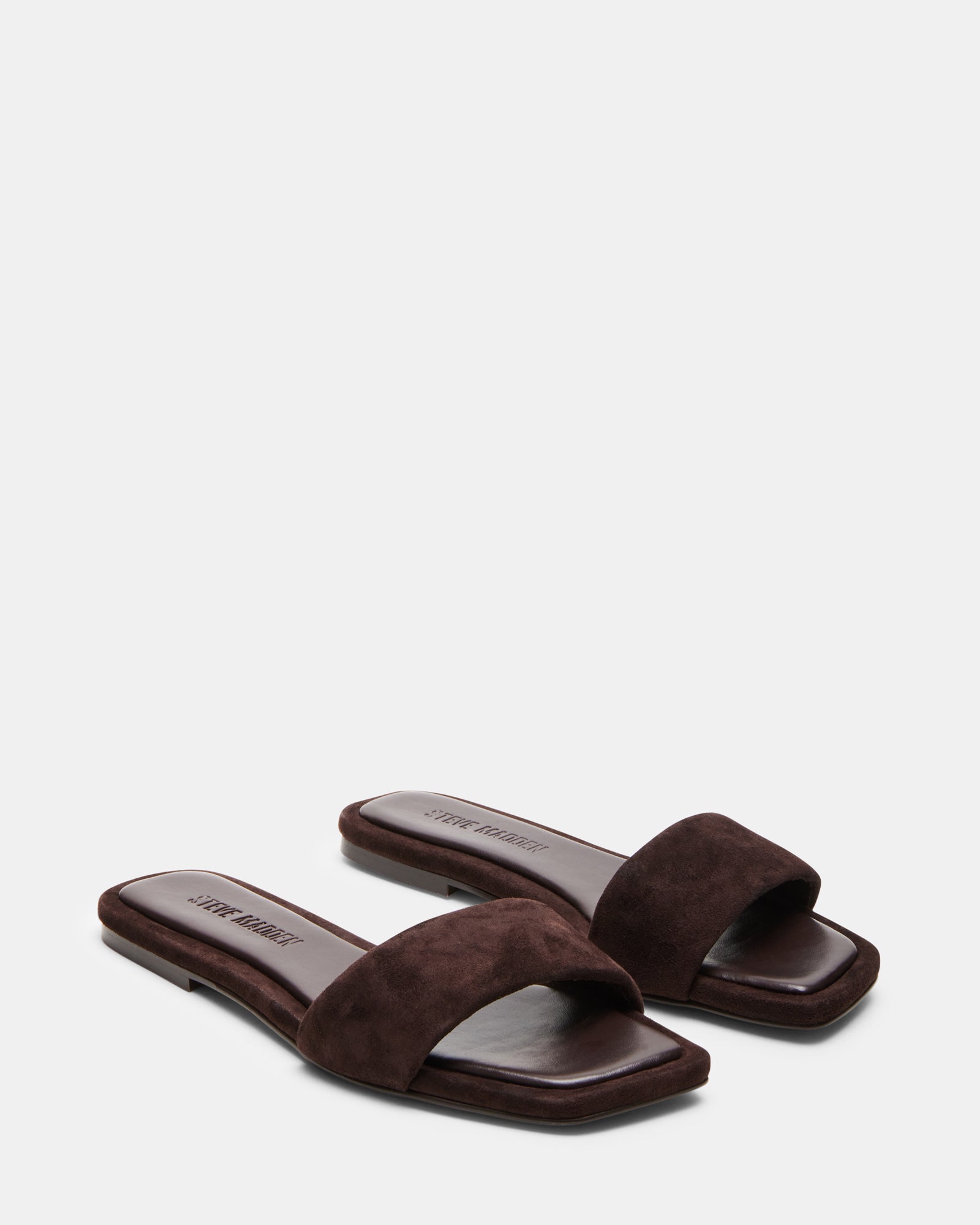 LUMINA flat sandals worn at a summer event.