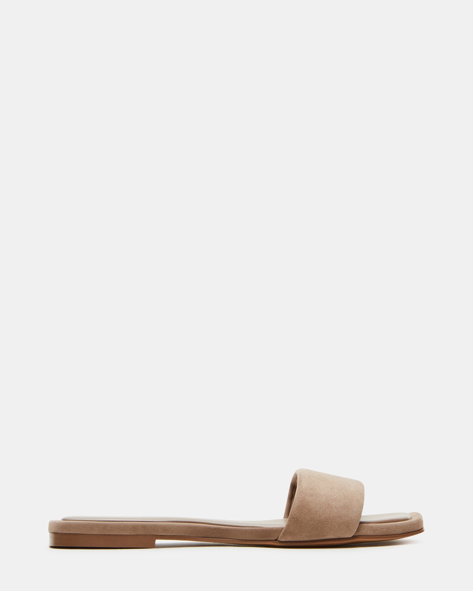 Side view of taupe suede slide sandals against a neutral background.