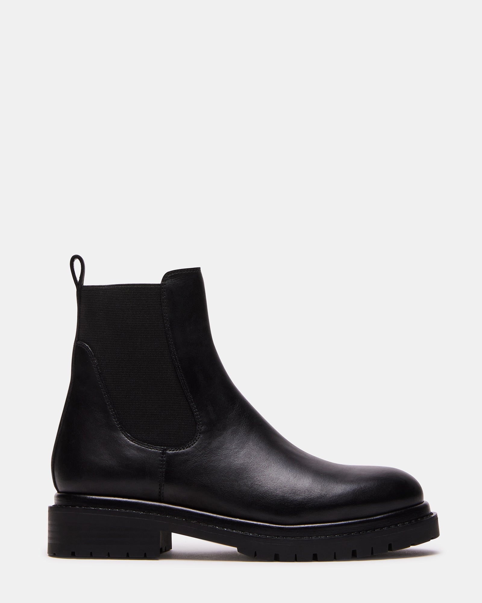 Side view of black leather Chelsea boot with treaded platform sole and pull loop