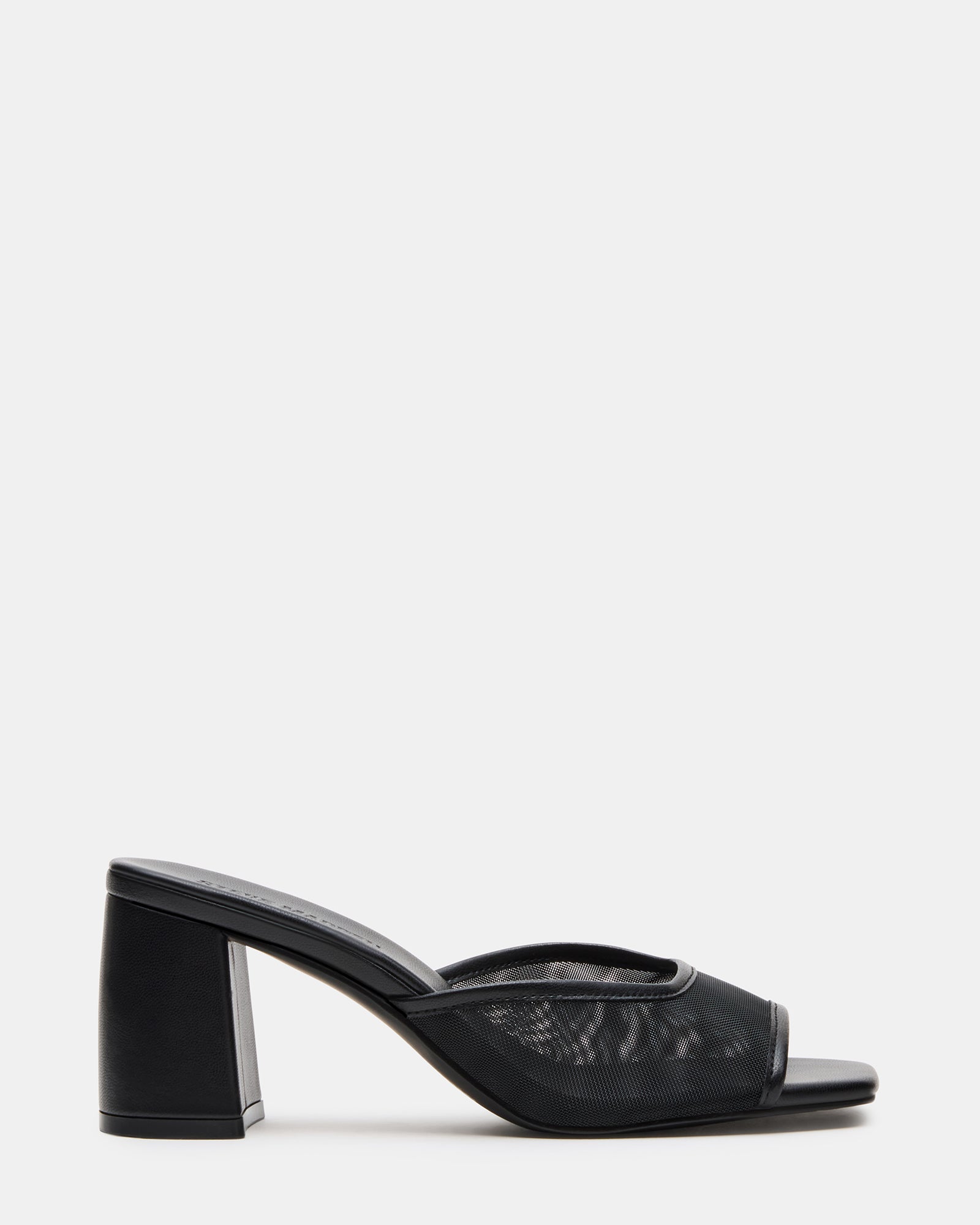 Madame Black block heel mules worn outdoors with jeans
