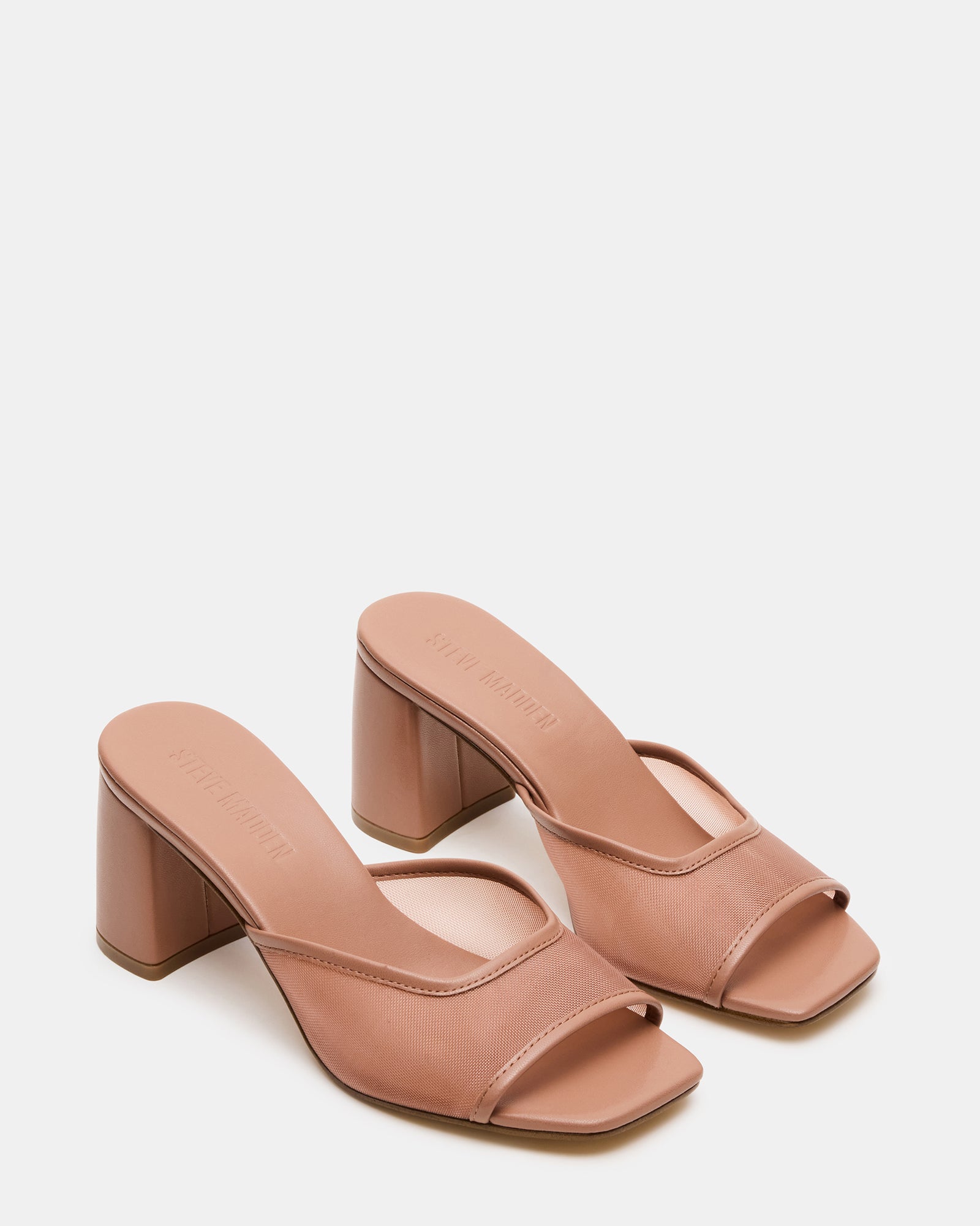 Close-up of mesh block heel construction on black square toe heels