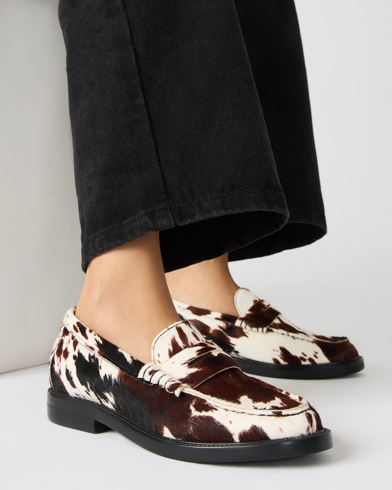 Madison loafers styled with casual attire for a chic look.