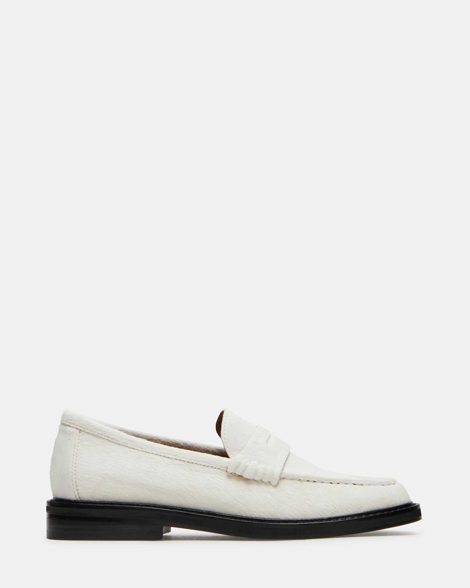 Side view of the MADISON white multi leather loafers on a wooden surface