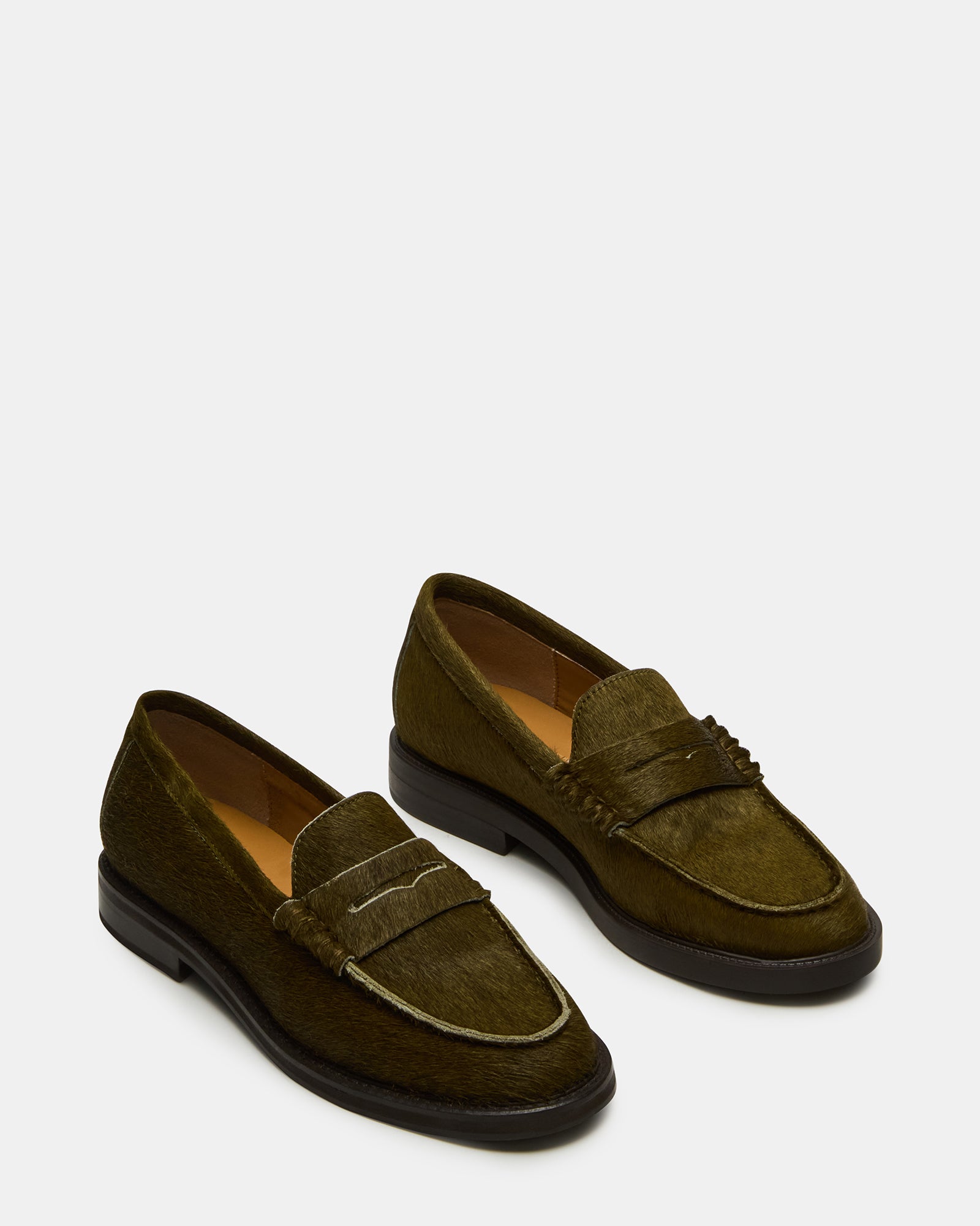 Fashionable women wearing MADISON OLIVE loafers for a casual outing