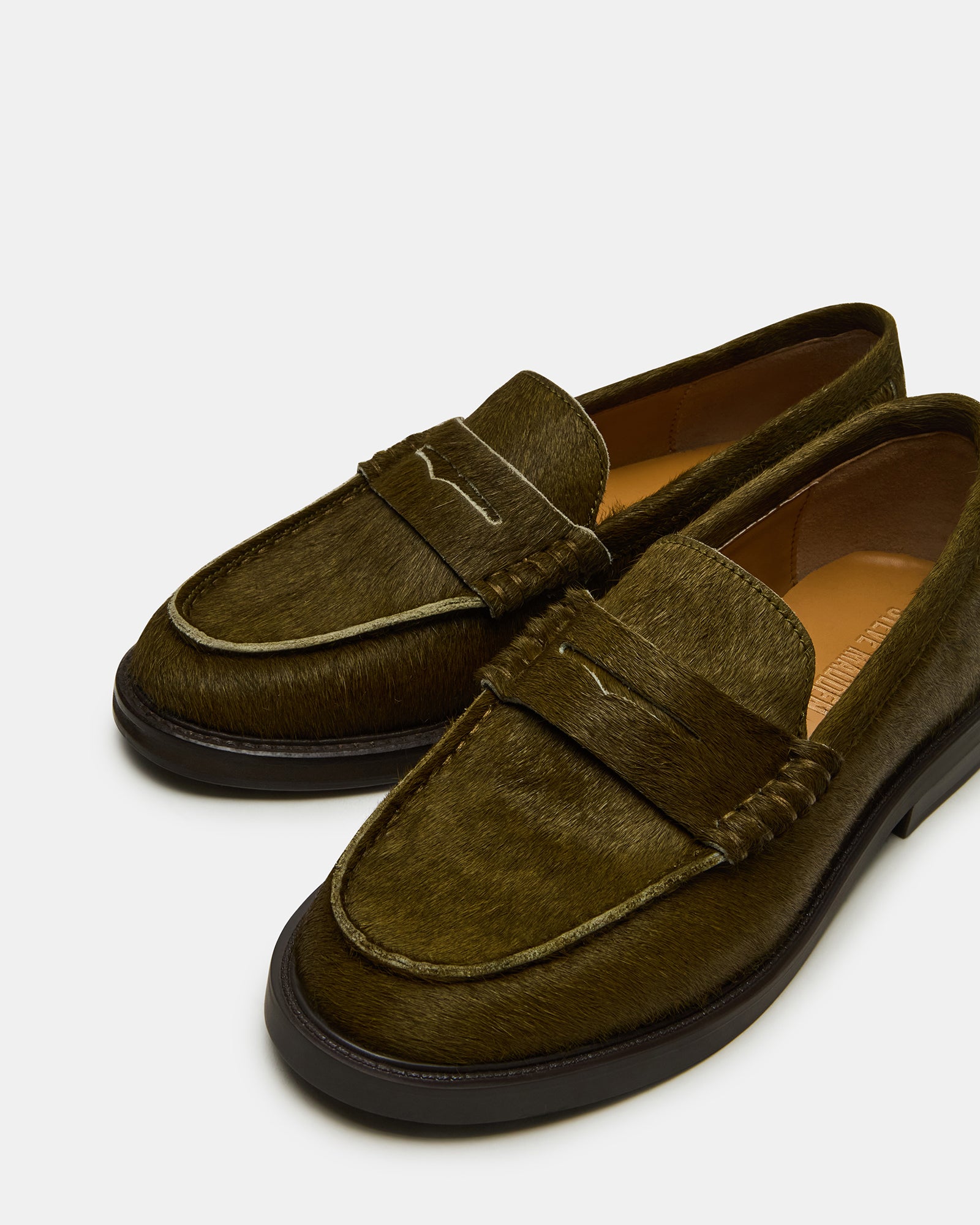 Close-up of the 1-inch heel and synthetic sole of MADISON OLIVE loafers