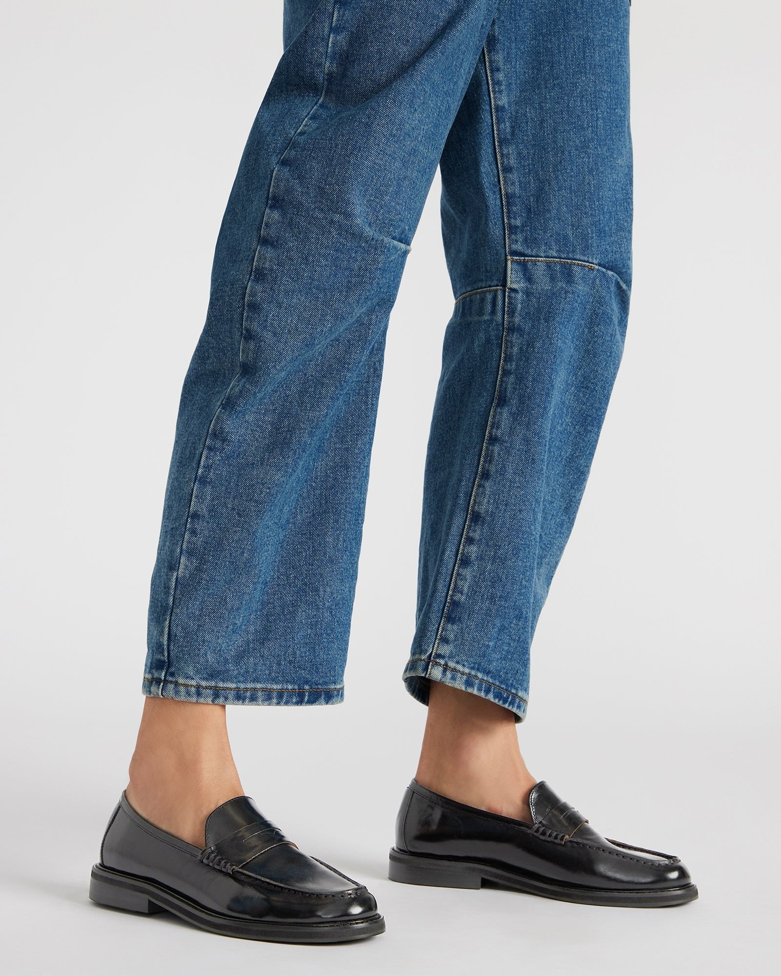 Close-up of penny slot detail on mens dress loafers