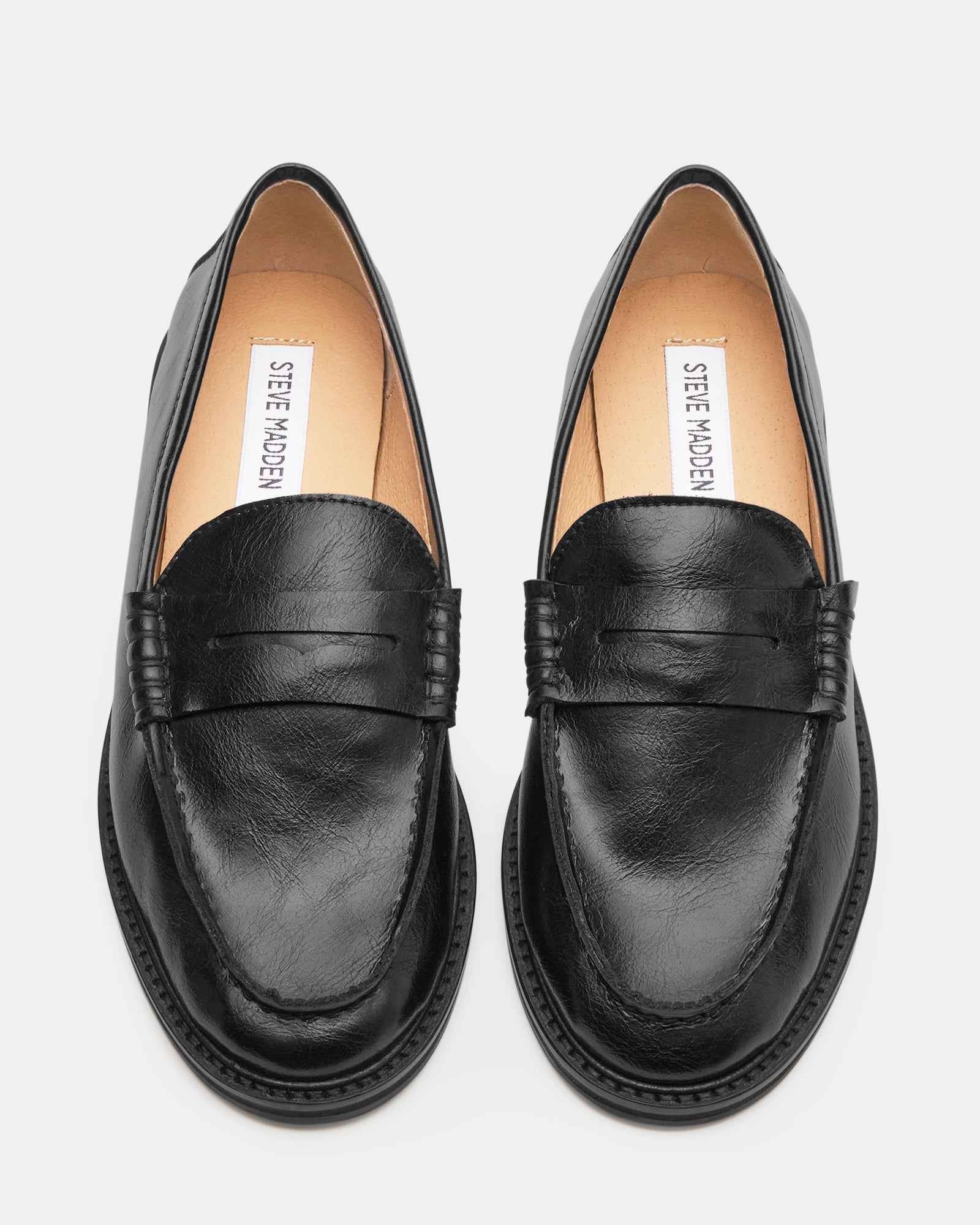 Close-up of penny slot detail on mens dress loafers