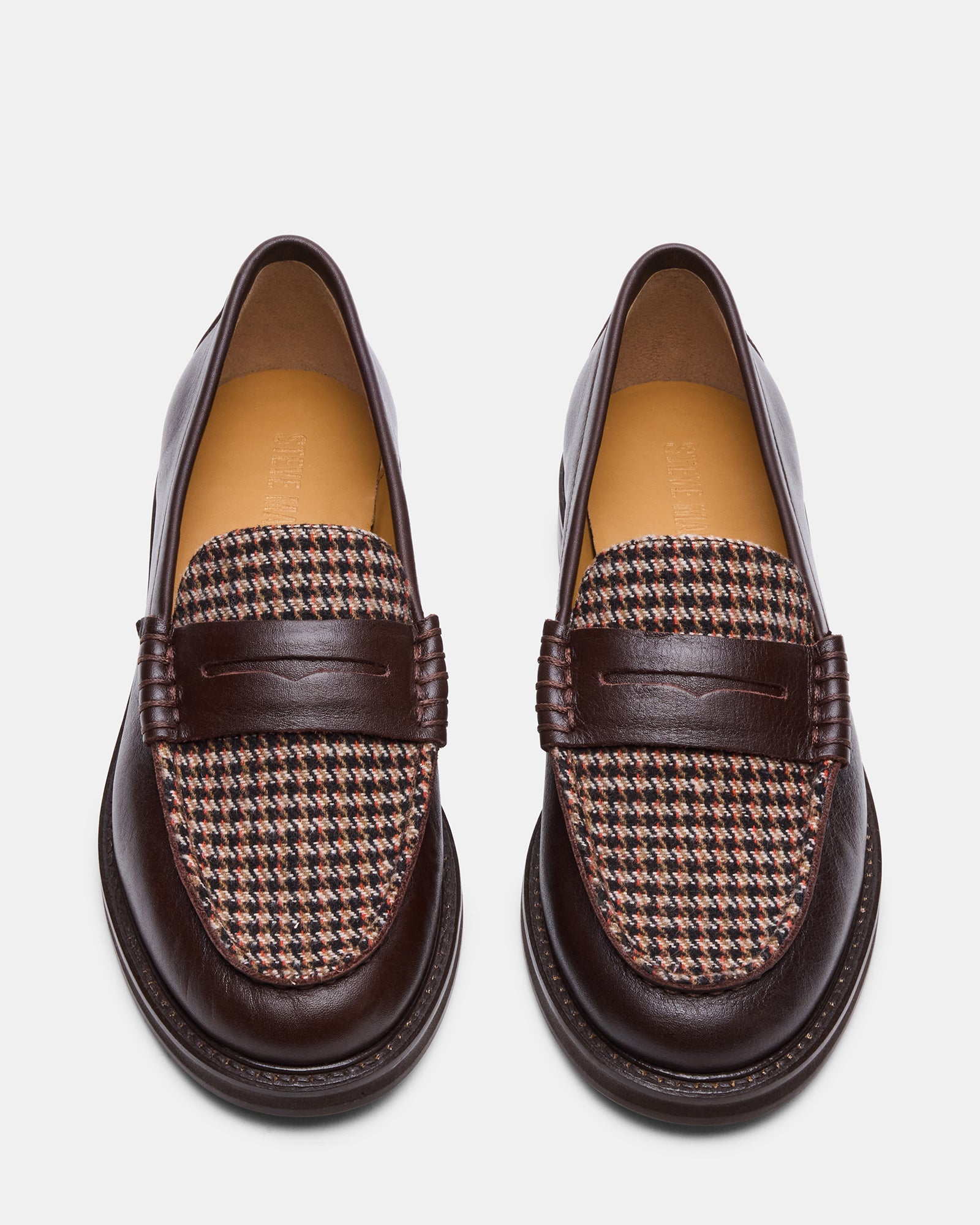 Front view of Madison brown leather loafers for women on a casual outfit