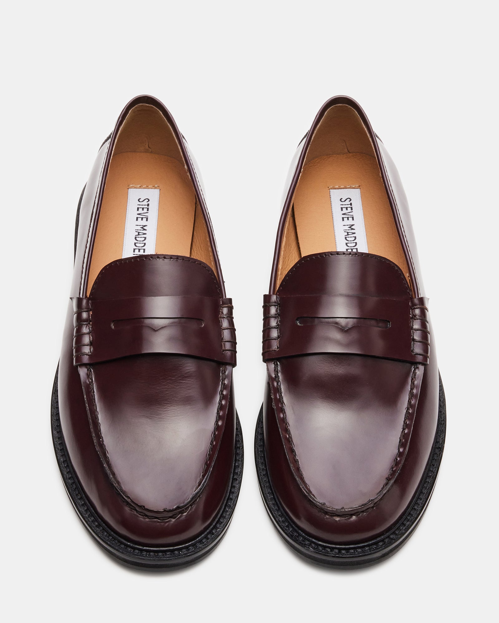 Side profile of womens brown leather loafers highlighting the 1-inch heel