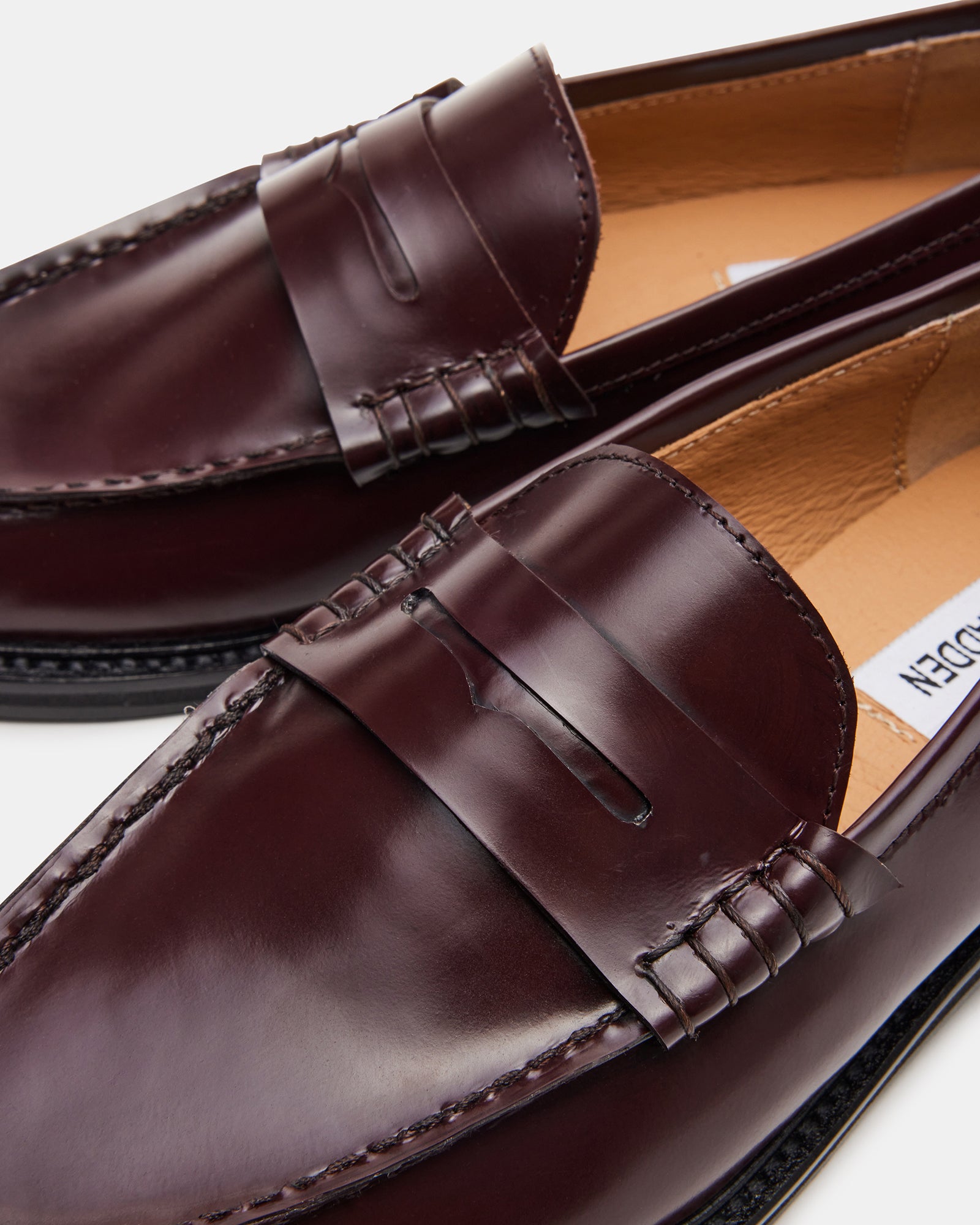 Front view of Madison burgundy leather loafers showing patent leather shine