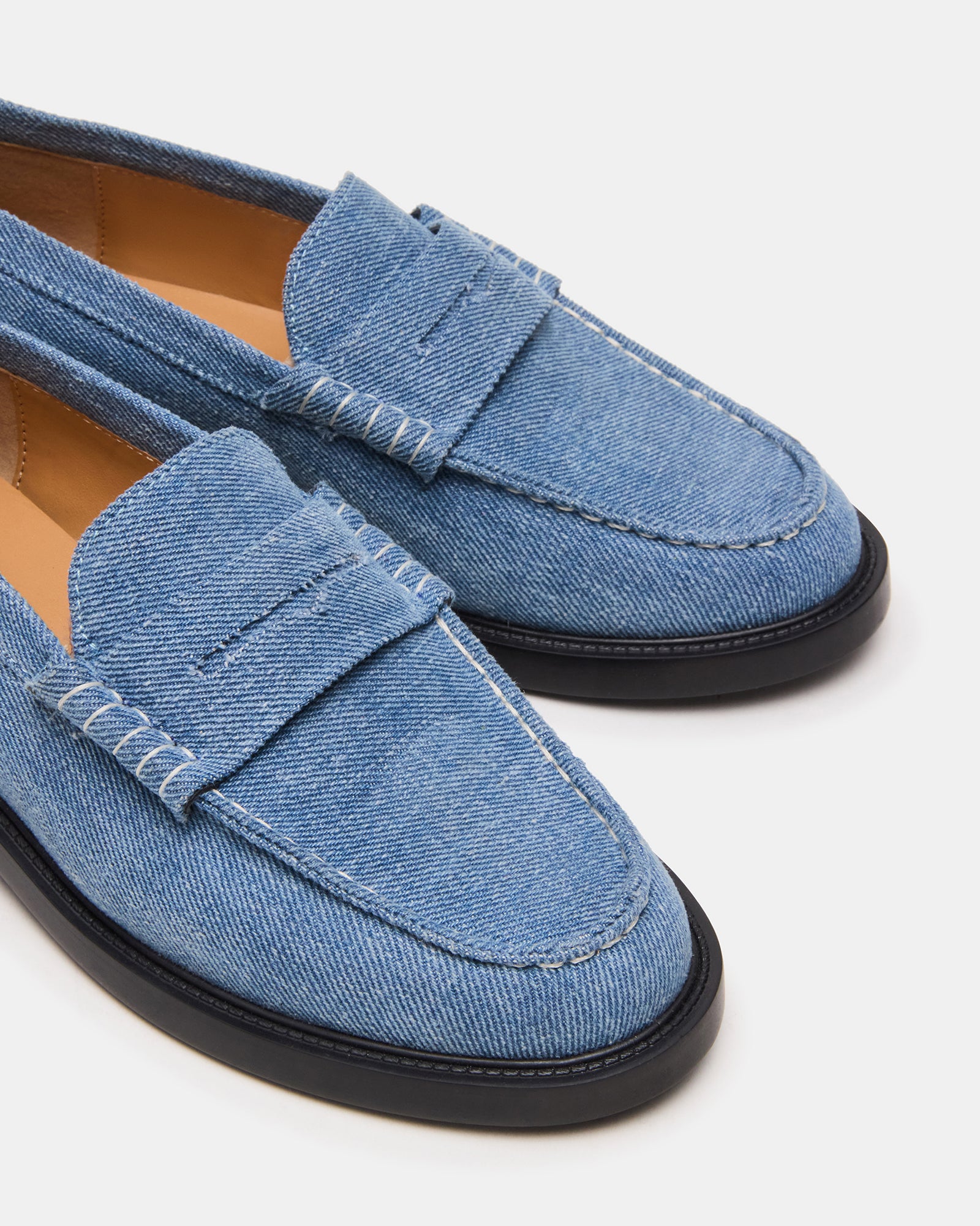 Casual style shot of mens loafers worn with jeans for everyday comfort