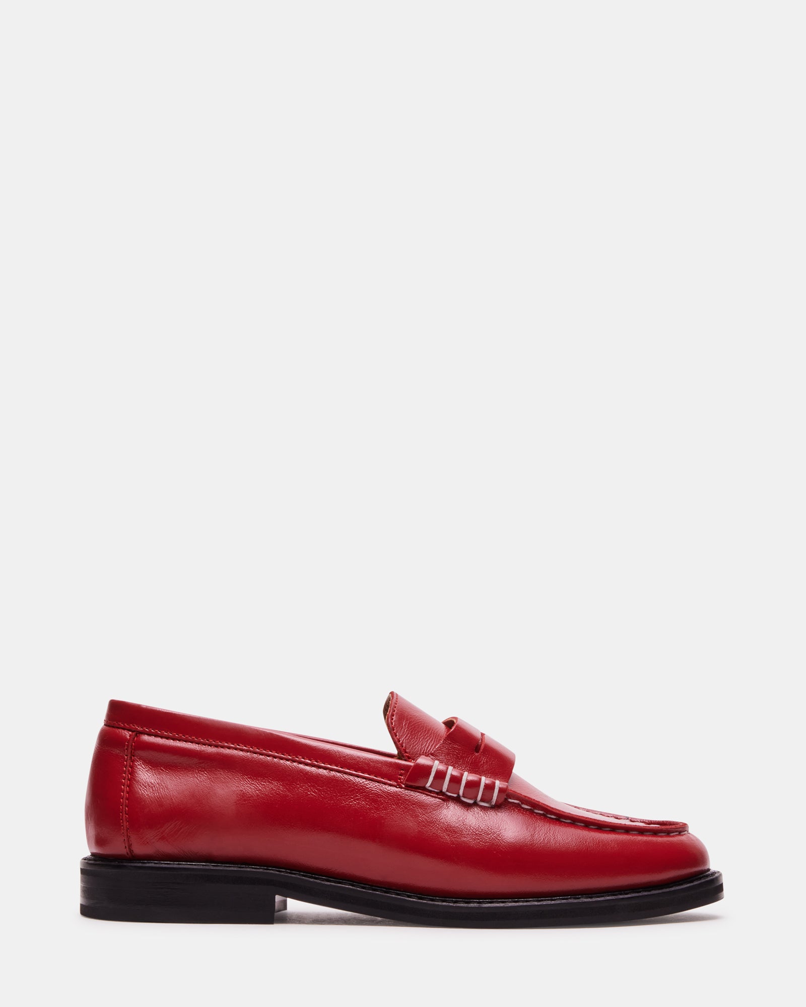 Madison red leather loafers for women shown with tailored trousers