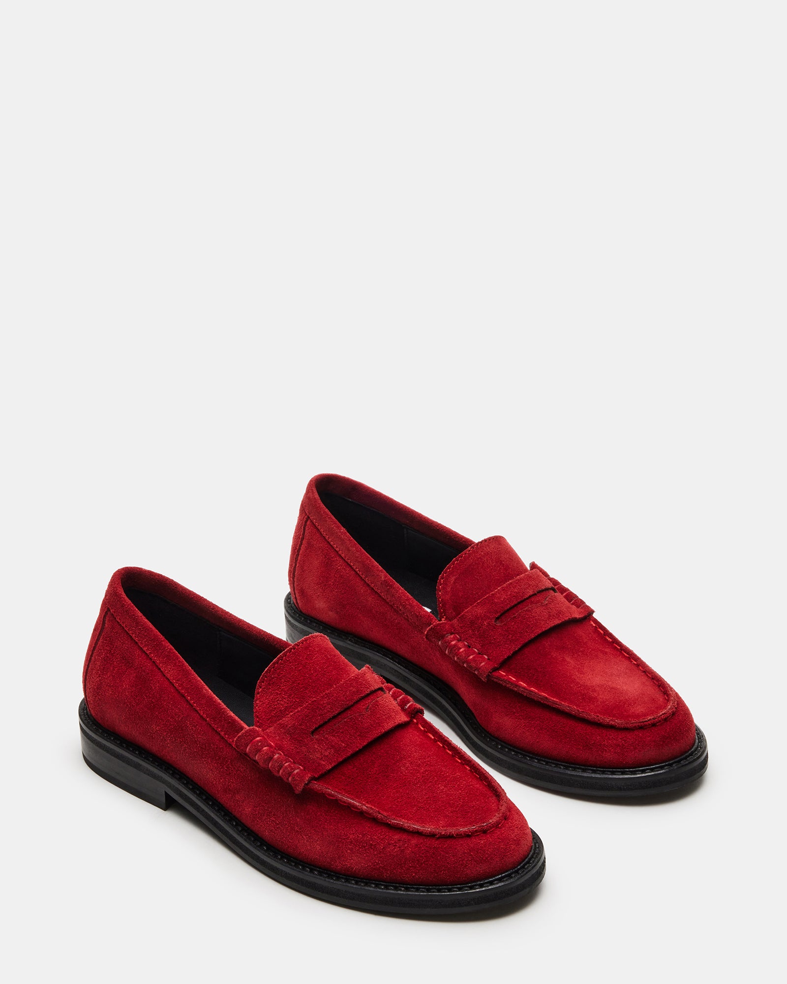 Close-up of penny loafer stitching detail showing premium craftsmanship