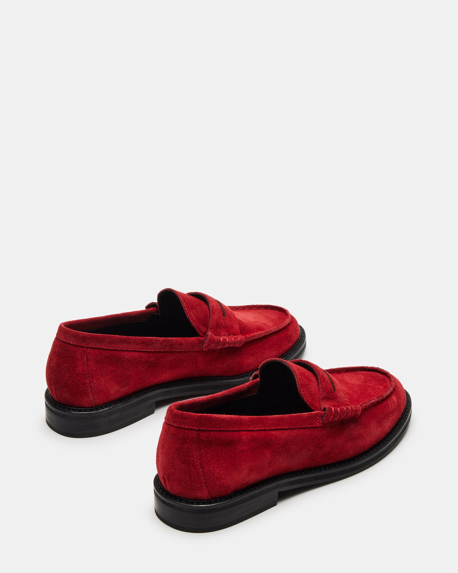Close-up of penny loafer stitching detail showing premium craftsmanship