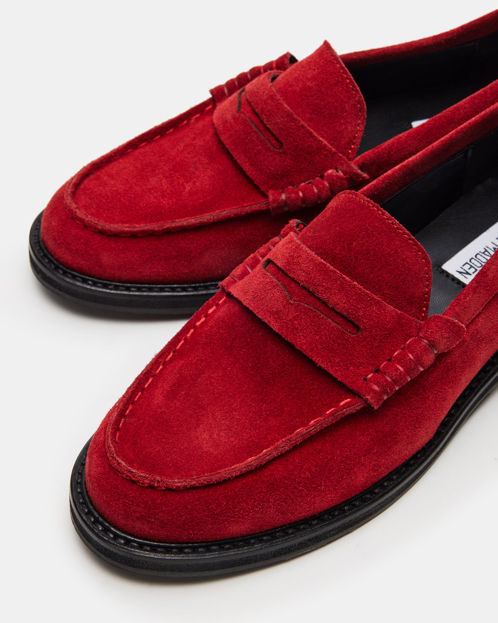Brown suede loafers styled with jeans for smart weekend wear
