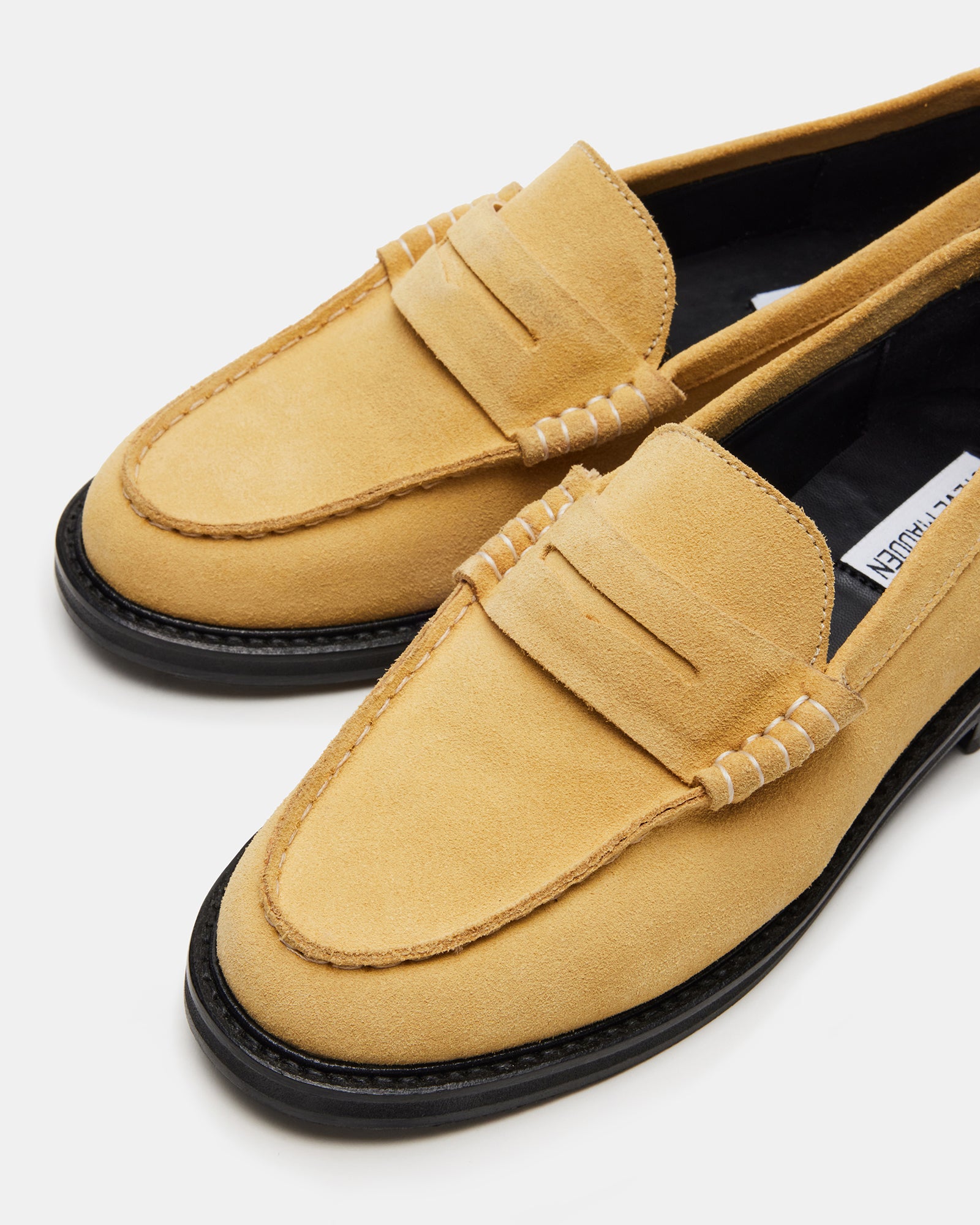 Detail shot of loafers and penny slot design highlighting refined craftsmanship