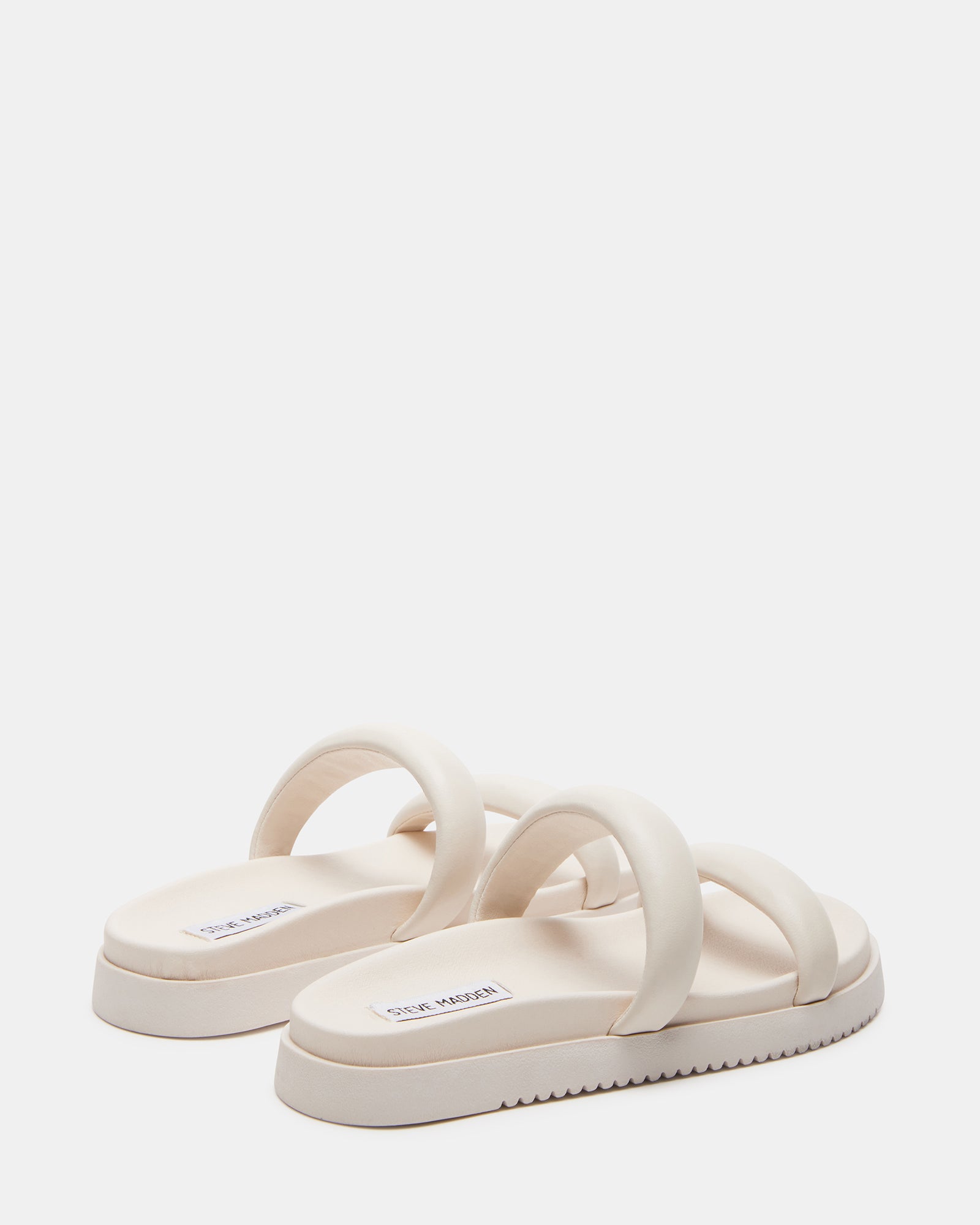 Close-up of the molded footbed of MADI BONE slide sandals