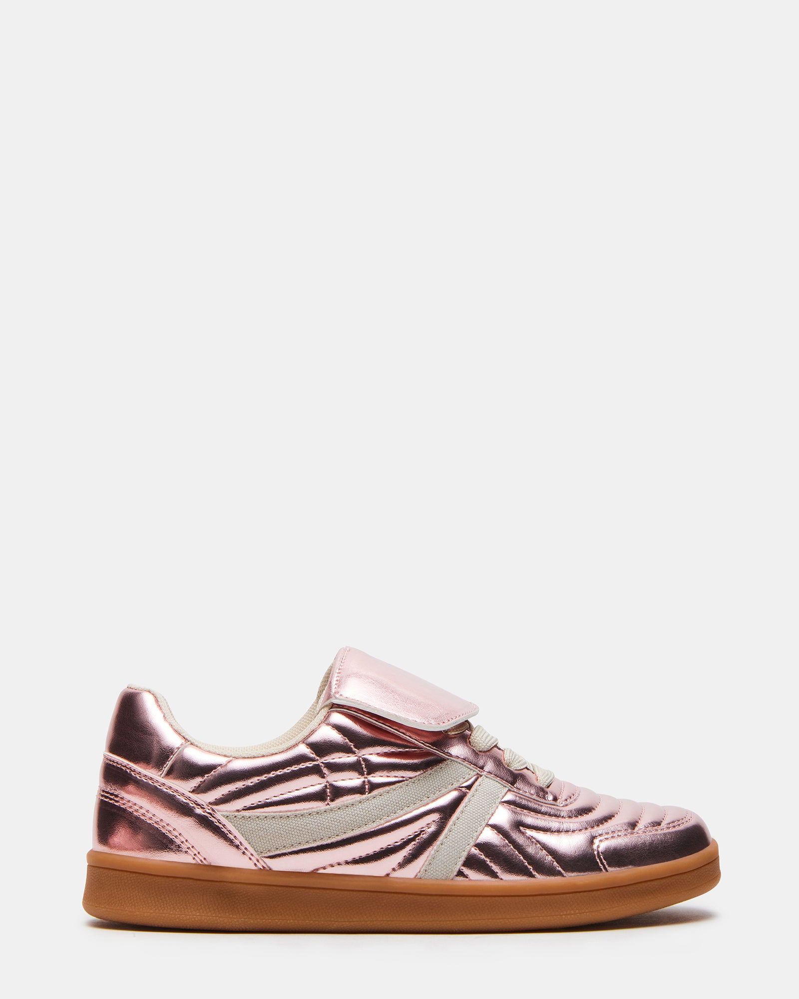 Side view of Bottega Madrid pink metallic sneakers on a wooden surface