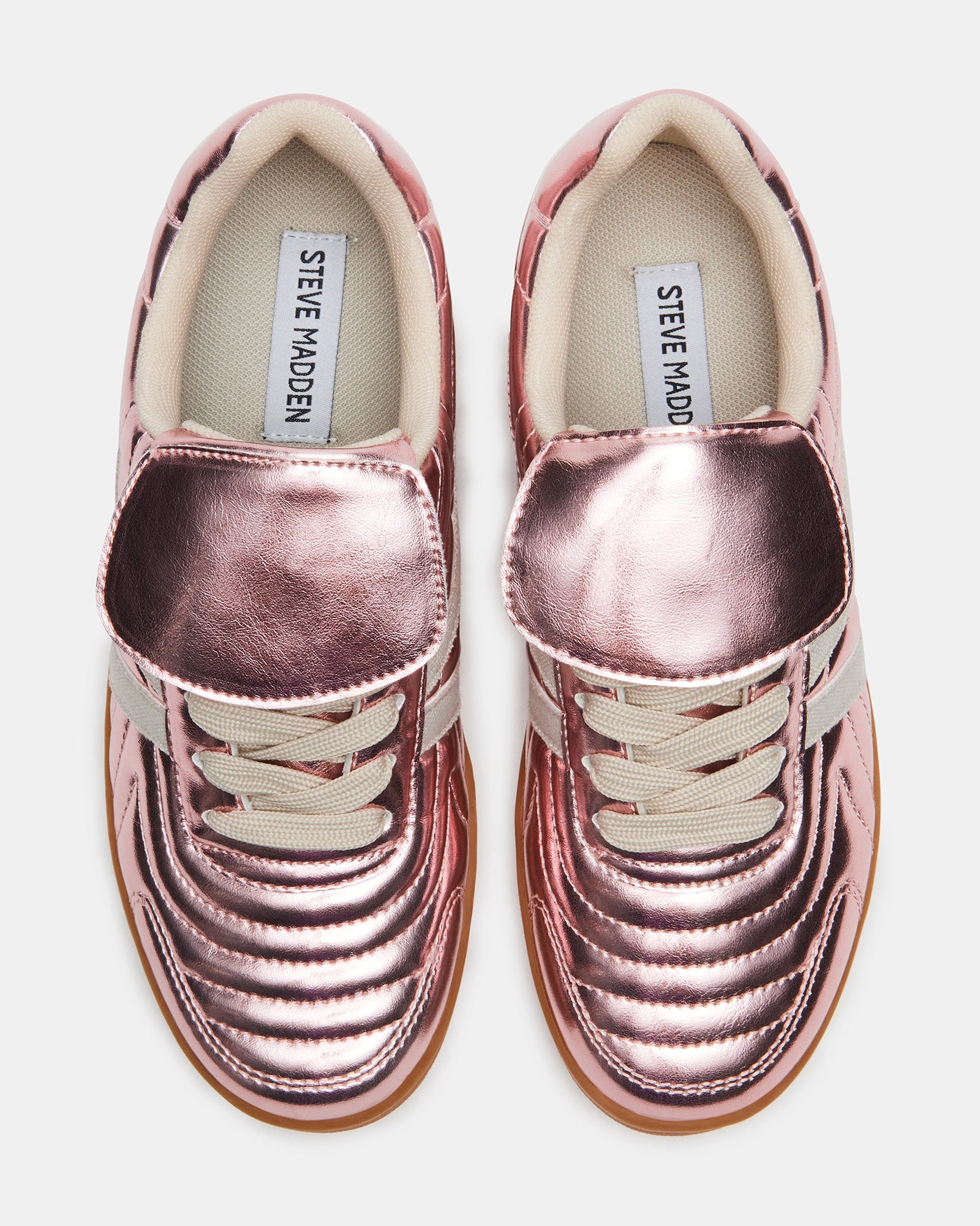 Close-up of the lace-up detail on these white fashion sneakers
