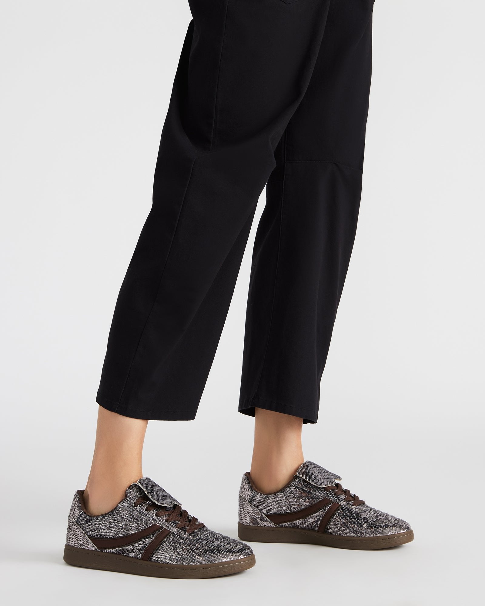 Model wearing Madrid Sequin Pewter low-top shoes with casual outfit
