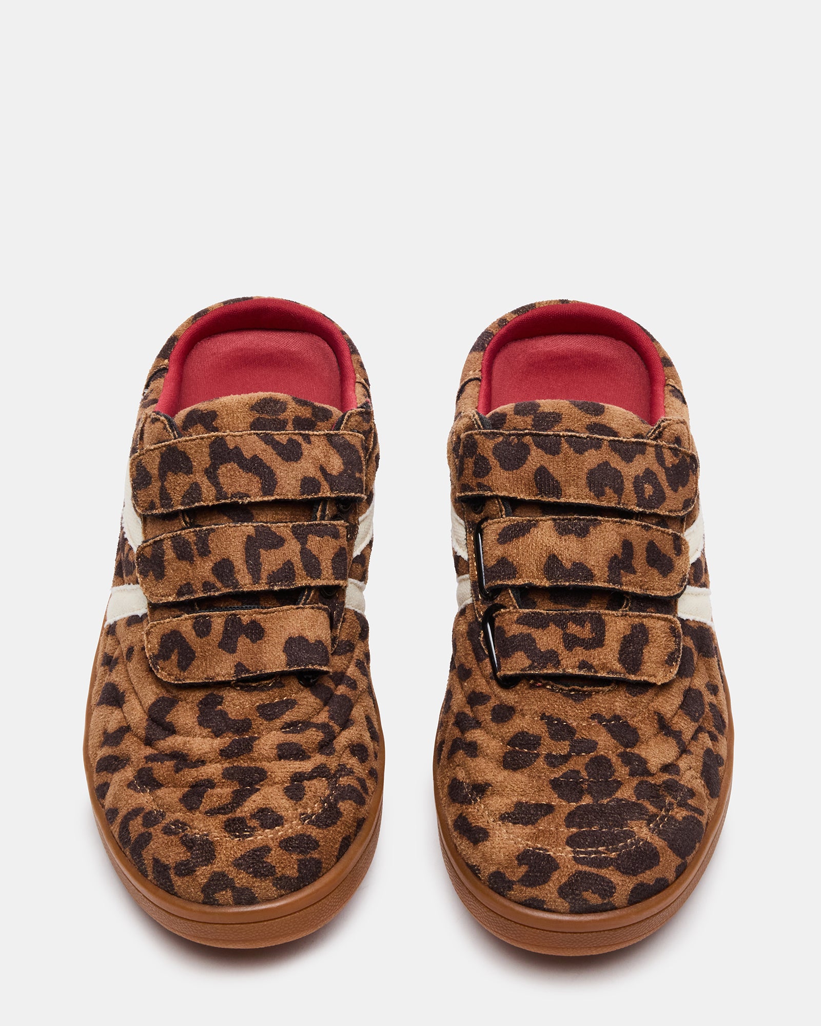 Side view of mule sneakers with Velcro straps, styled for busy urban mornings