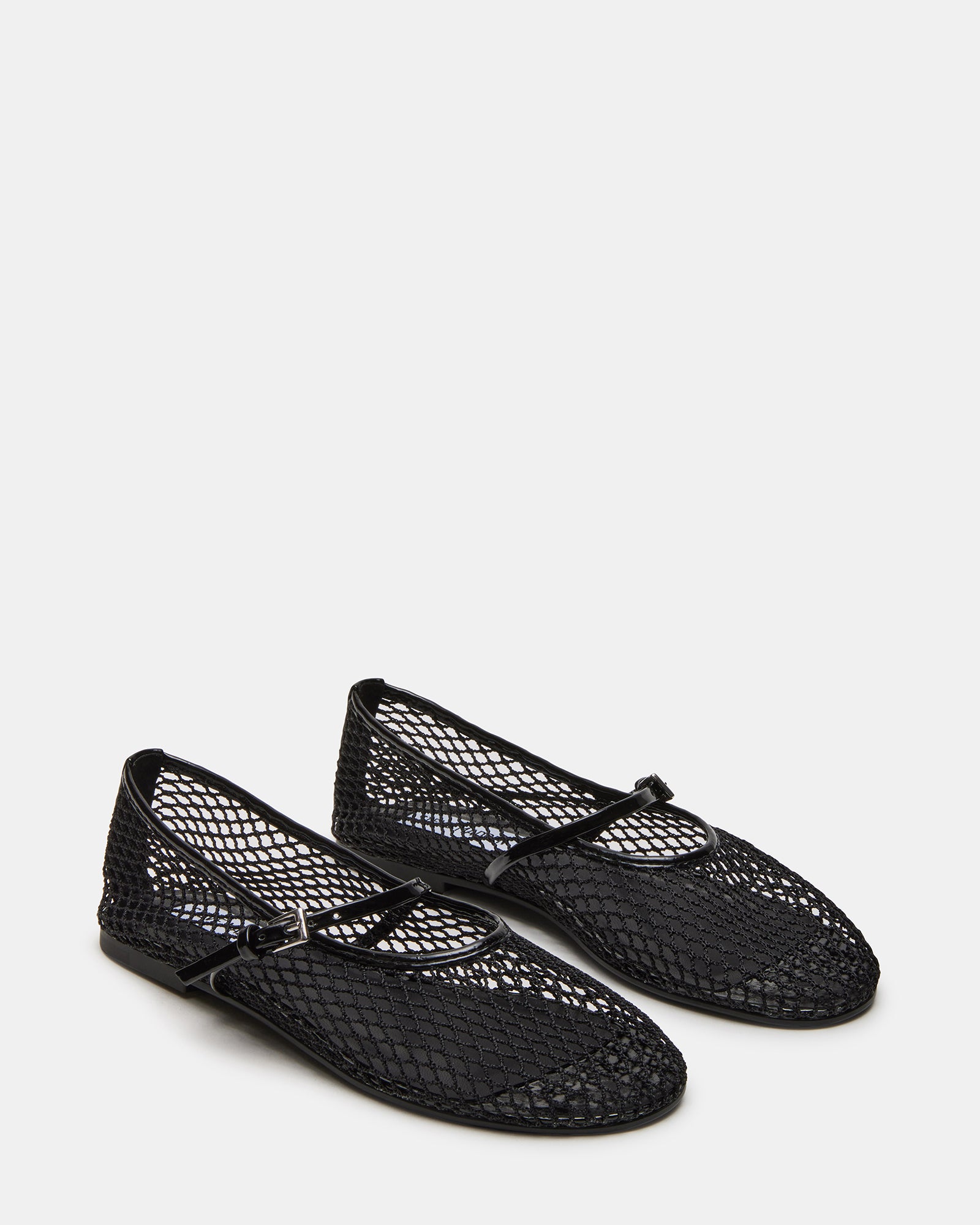Black Mary Jane ballet flats worn in a casual setting.