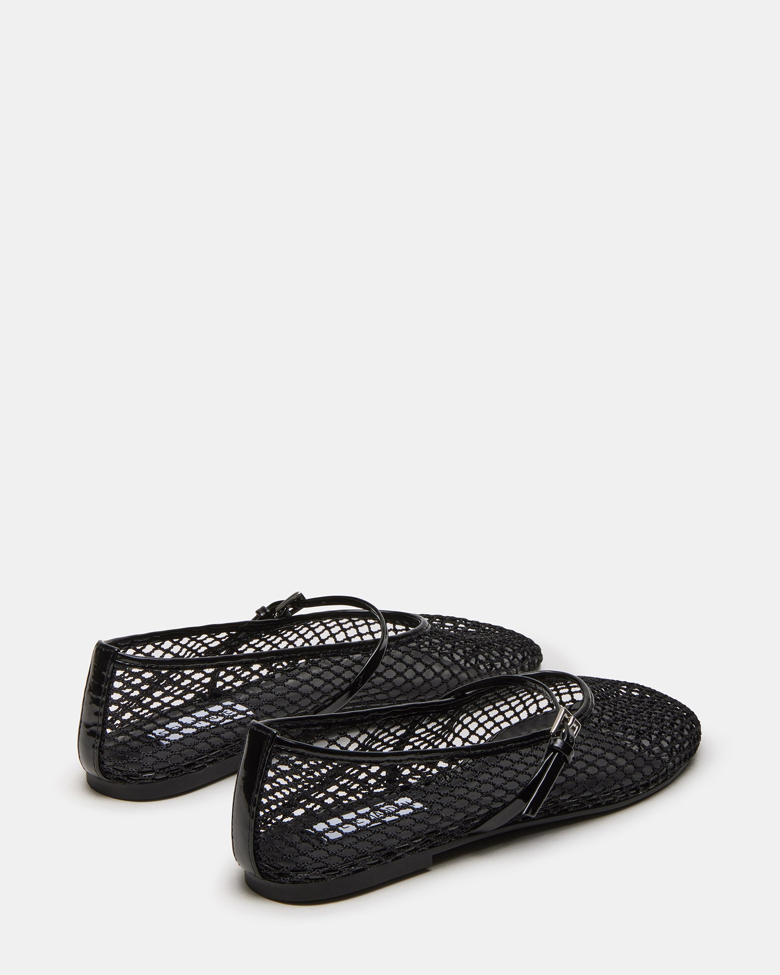 Black Mary Jane ballet flats worn in a casual setting.
