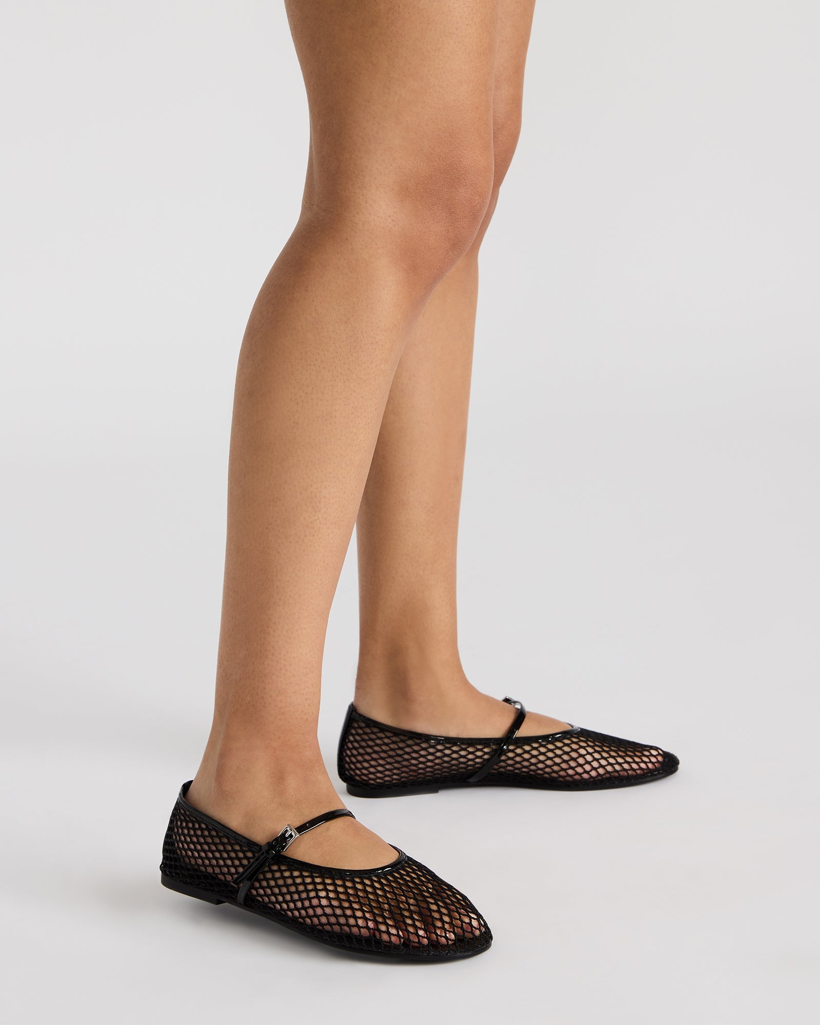 Fashionable mesh flats featuring a sleek design and synthetic sole