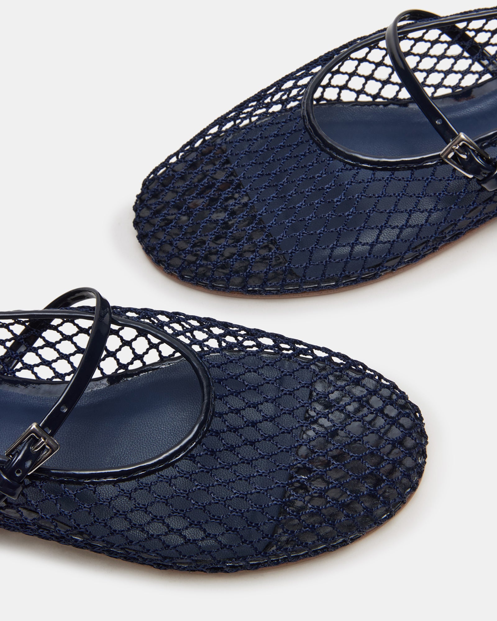 Fashionable mesh flats featuring a sleek design and synthetic sole