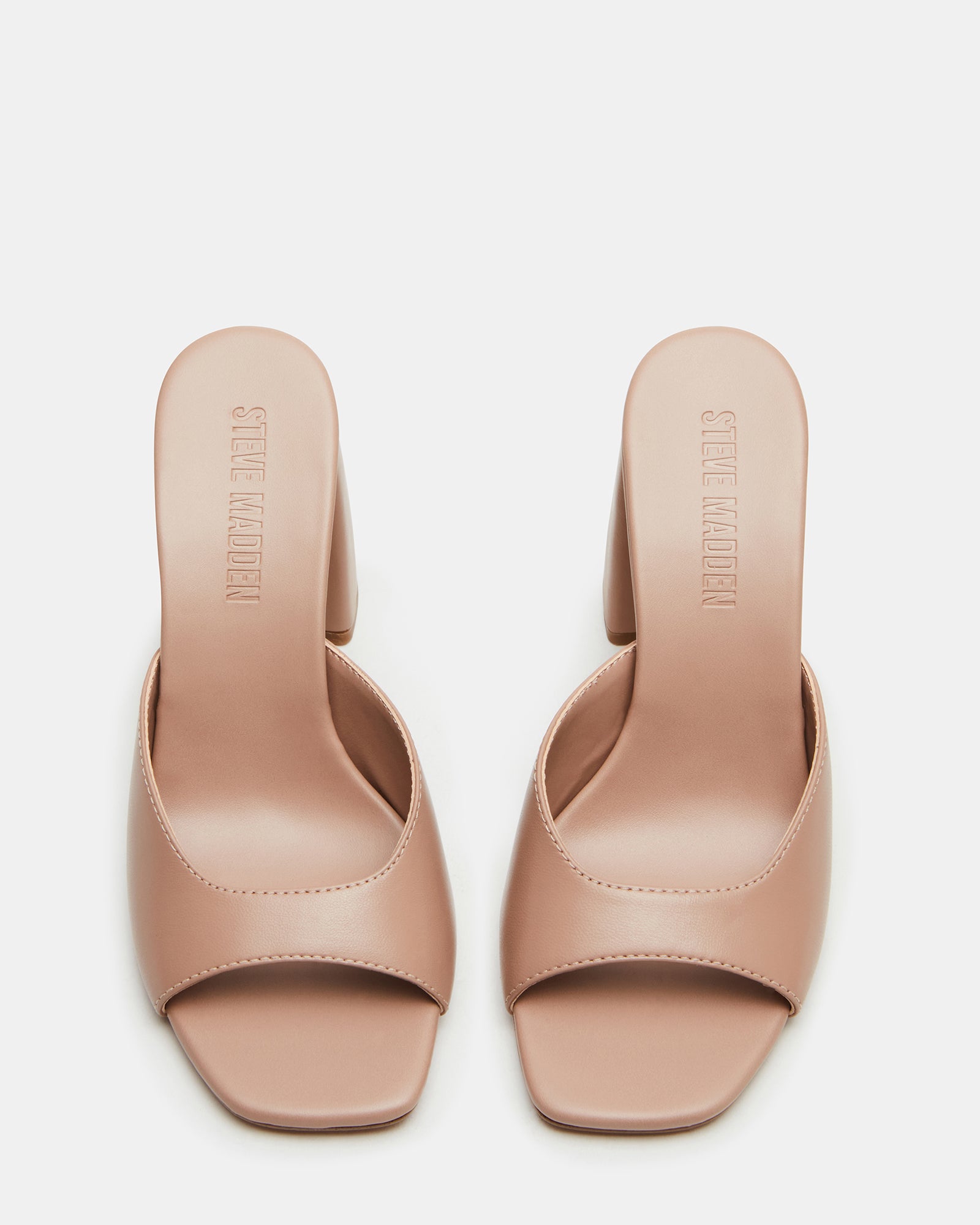Elegant square toe block heel mules showcasing a chic design.