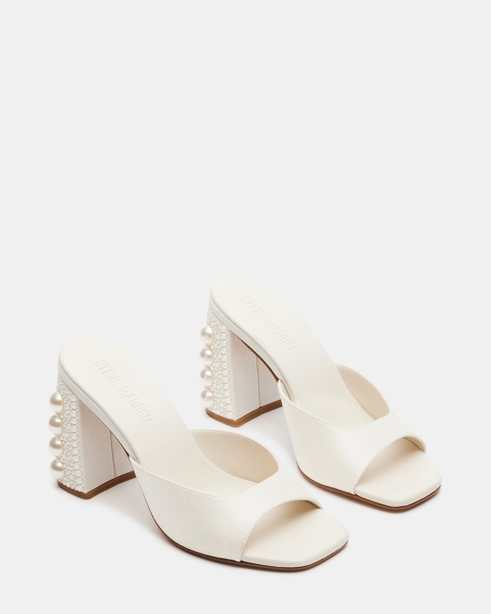 Top-down angle of kitten heel mules shoes styled with a summer dress